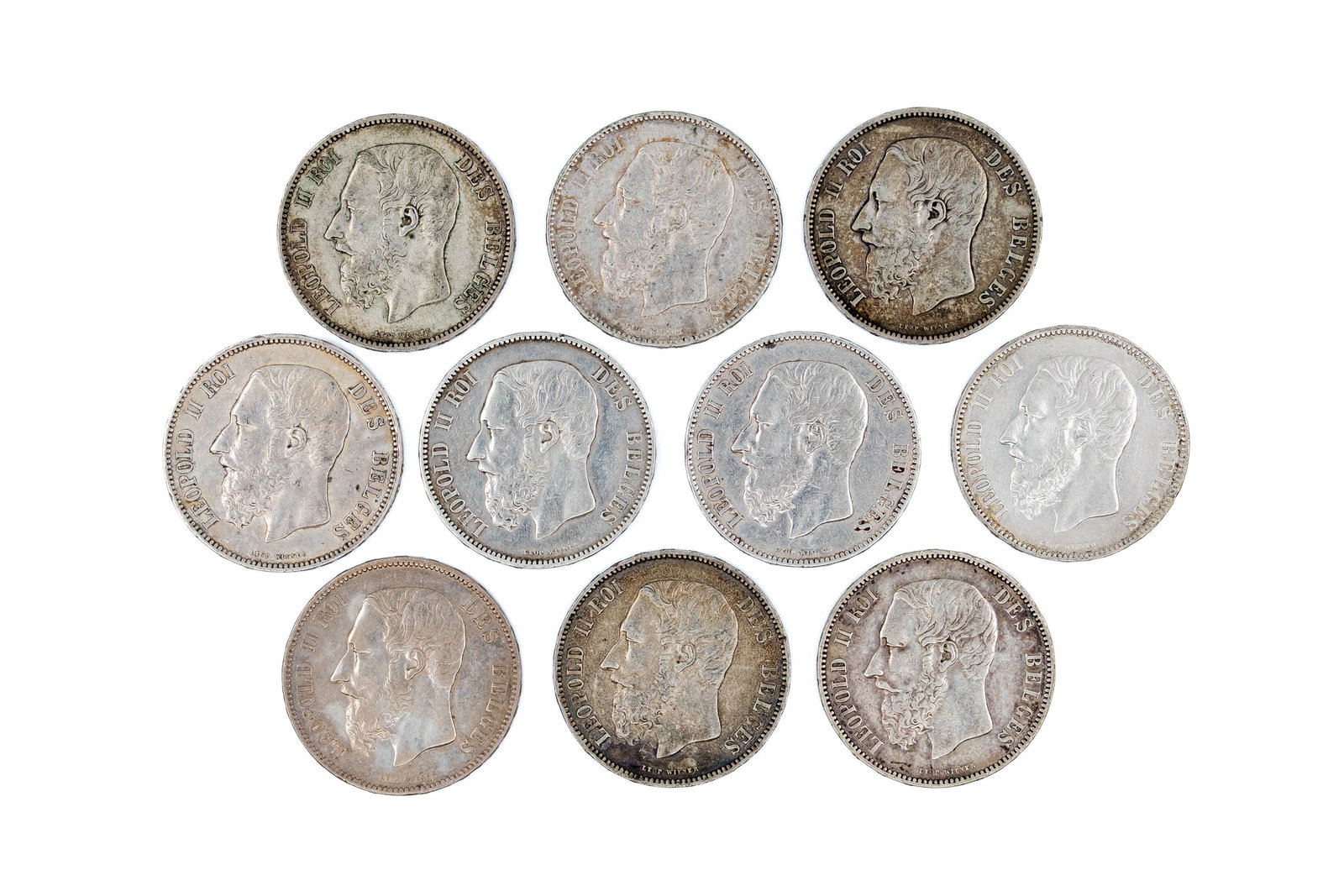 A lot of 10 Belgian silver 5 Francs coins of Leopold II, dated 1869-1876: A lot of 10 Belgian silver 5 Francs coins of Leopold II, dated 1869-1876. All issues of Leopold II, with crowned coat of arms within wreath reverse. Total weight: 249,2g