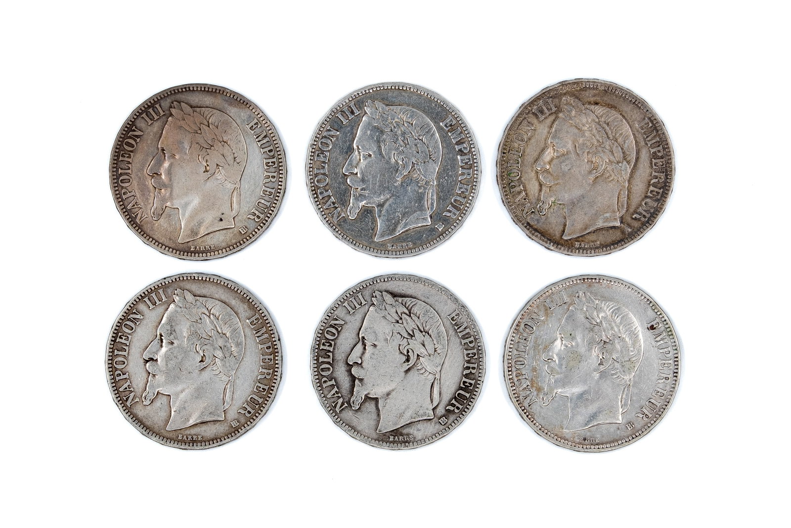 A lot of six French silver 5 Francs coins of Napoleon III, dated 1867-1870: A lot of six French silver 5 Francs coins of Napoleon III, dated 1867-1870. All issues of Napoleon III with laureate head, all with imperial crowned arms reverse. Total weight: 148,8g