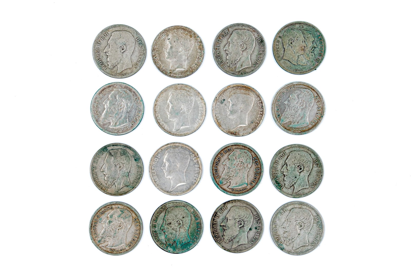A lot of 16 Belgian silver 2 Francs coins, dated 1886-1911: A lot of 16 Belgian silver 2 Francs coins, dated 1886-1911. Comprising issues of Leopold I, Leopold II and Albert I, including both French- and Dutch-legend types and a commemorative 1830-1880 issue b