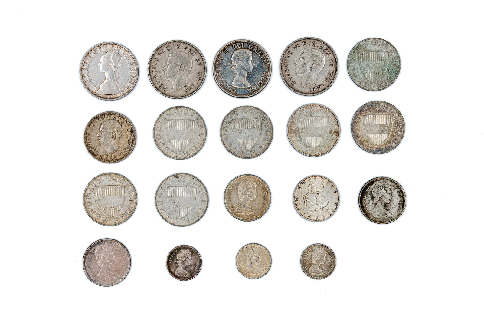 A lot of 19 assorted world silver coins, late 19th-20th century: A lot of 19 assorted world silver coins, late 19th-20th century. Comprising a varied group of European and overseas issues, including Austria, Canada, Great Britain, Italy and other states, with portr