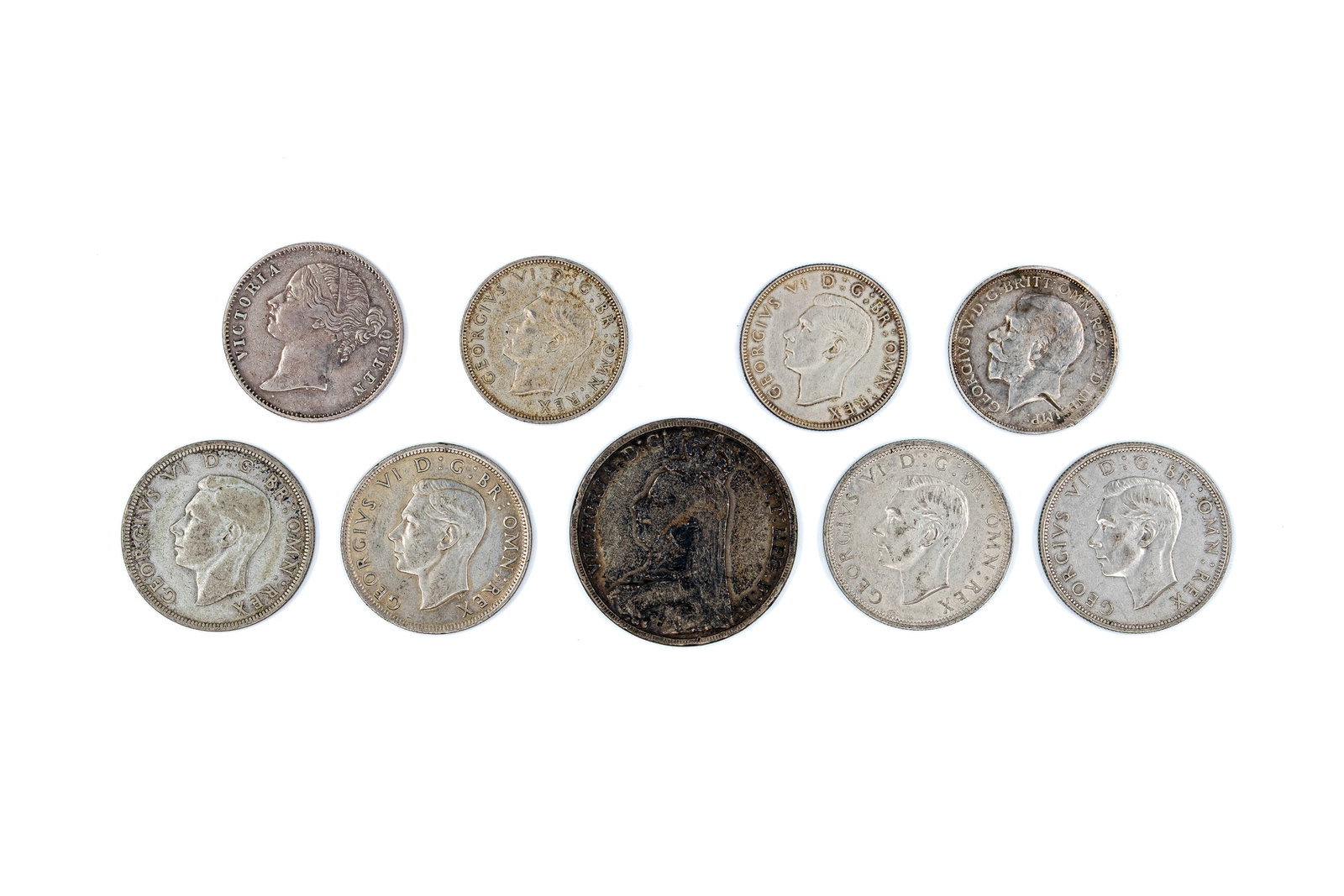 A lot of nine British and colonial silver coins, dated 1840-1945 (1 of 2)