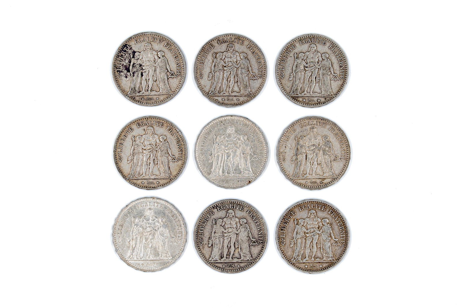 A lot of nine French silver 5 Francs coins, dated 1849-1875: A lot of nine French silver 5 Francs coins of the Second Republic, dated 1849-1875. All Hercule type issues with Liberty, Equality and Fraternity design, and wreath reverse enclosing the denomination.