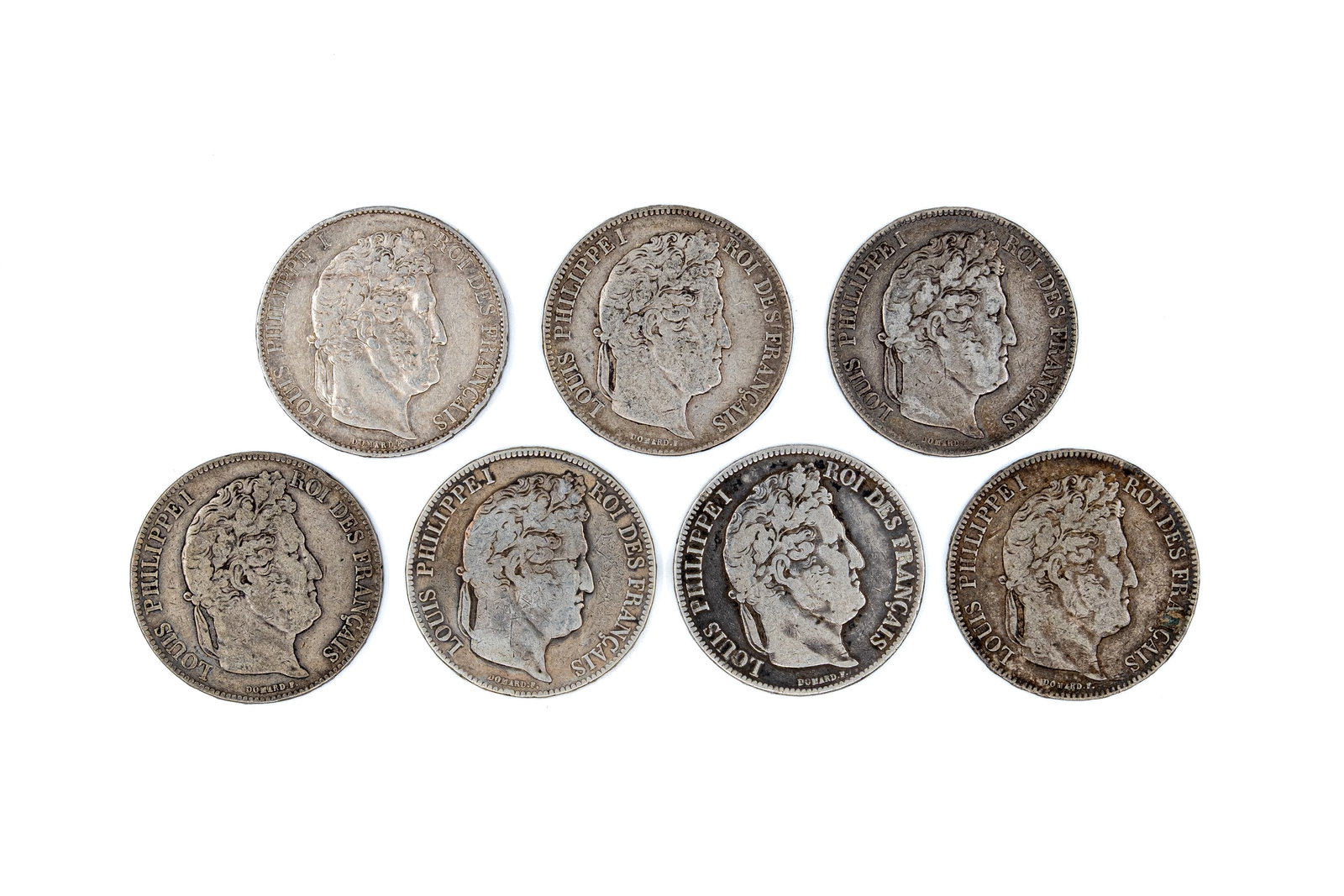 A lot of seven French silver 5 Francs coins of Louis Philippe I, dated 1832-1847: A lot of seven French silver 5 Francs coins of Louis Philippe I, dated 1832-1847. Comprising all silver issues with wreath reverse and denomination within. Total weight: 173,1g