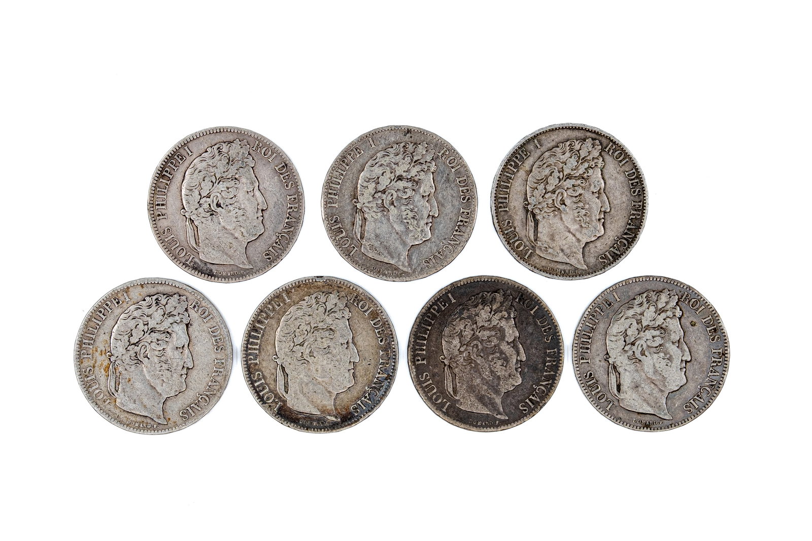 A lot of seven French silver 5 Francs coins of Louis Philippe I, dated 1835-1847: A lot of seven French silver 5 Francs coins of Louis Philippe I, dated 1835-1847. Comprising all silver issues with wreath reverse and denomination within. Total weight: 173,2g