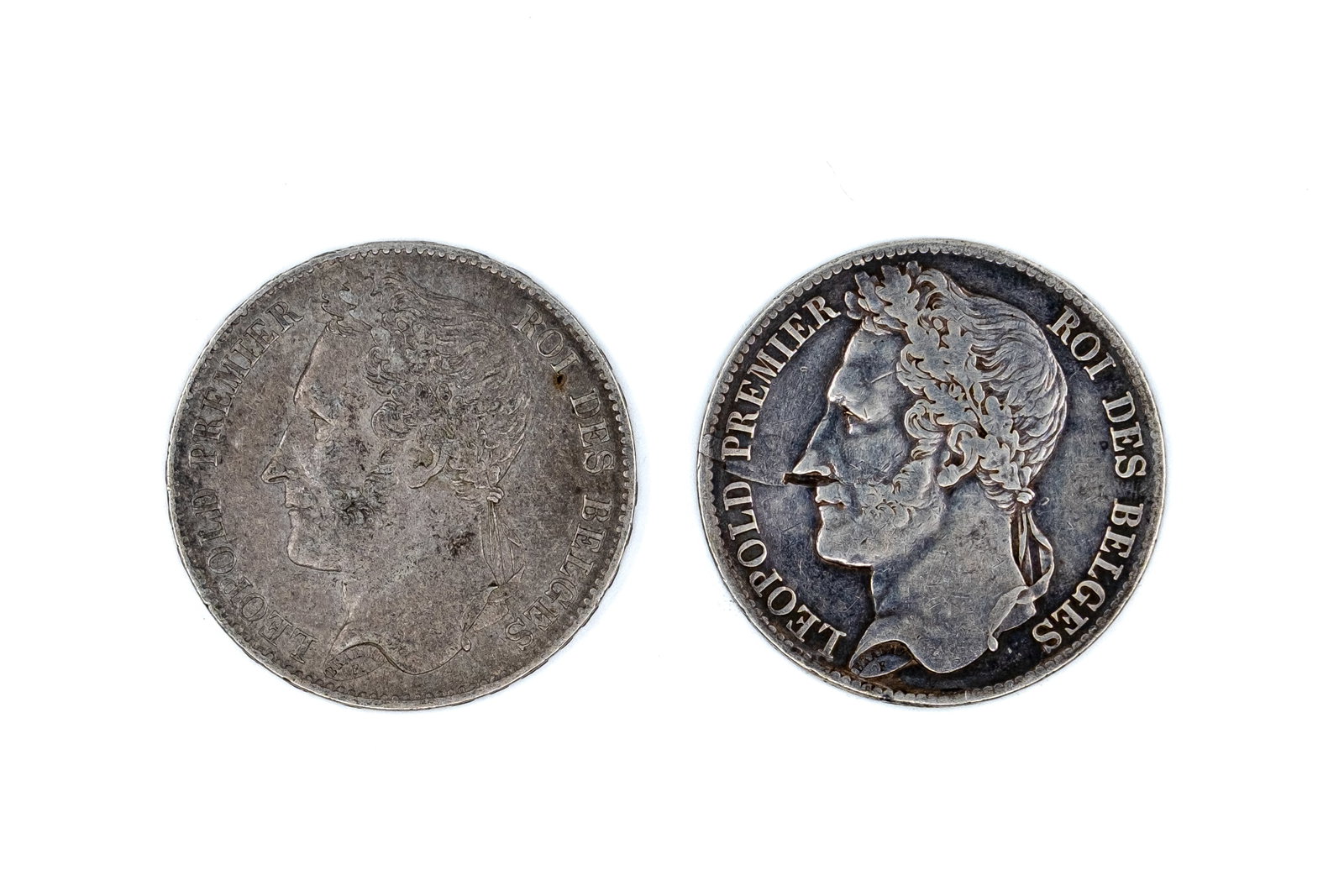A lot of two Belgian silver 5 Francs coins of Leopold I, dated 1844-1849: A lot of two Belgian silver 5 Francs coins of Leopold I, dated 1844-1849. Both silver issues with wreath reverse and denomination within. Weight: 24,9 - 24,7g