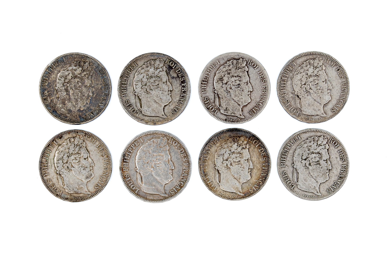 A lot of eight French silver 5 Francs coins of Louis Philippe I, dated 1831-1846: A lot of eight French silver 5 Francs coins of Louis Philippe I, dated 1831-1846. Comprising all silver issues with wreath reverse and denomination within. Total weight: 197,5g