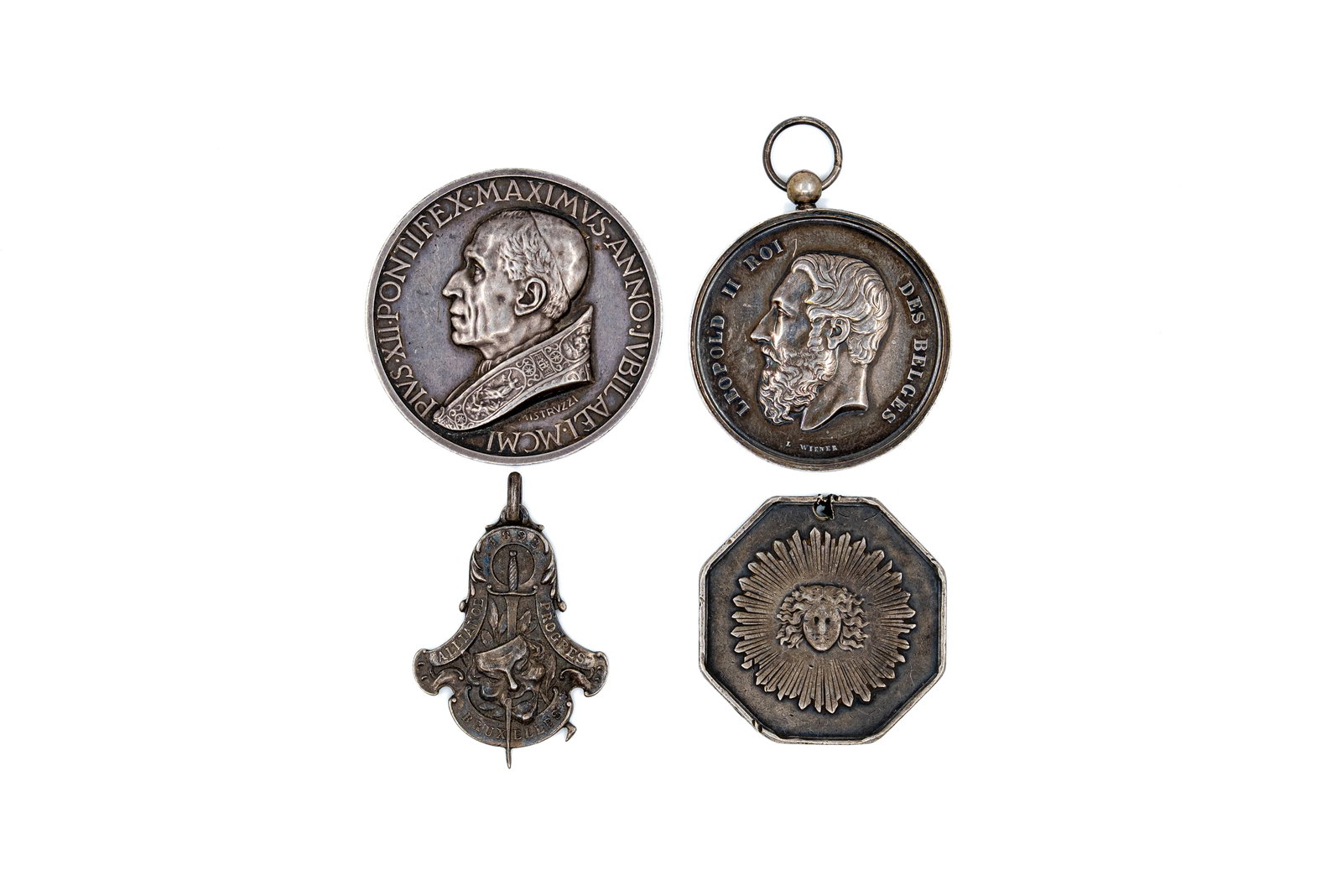 A lot of four medals and badges, 19th-20th century (1 of 2)