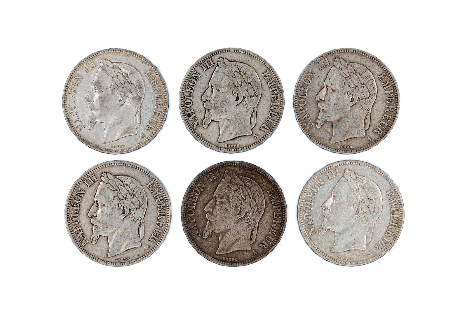 A lot of six French silver 5 Francs coins of Napoleon III, dated 1867-1869: A lot of six French silver 5 Francs coins of Napoleon III, dated 1867-1869. All Second Empire silver issues with laureate head of Napoleon III on the obverse, and the imperial arms with eagle, crown a