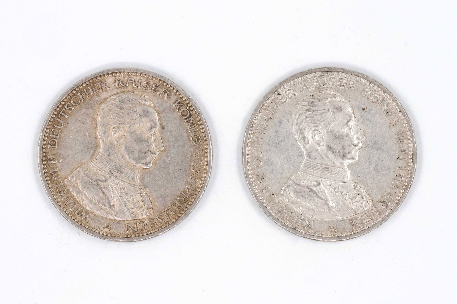 A lot of two German silver 5 Mark coins of Wilhelm II of Prussia, dated 1914: A lot of two German silver 5 Mark coins of Wilhelm II of Prussia, dated 1914. Both imperial issues with bust of the emperor facing right, the reverse depicting the imperial eagle and denomination belo