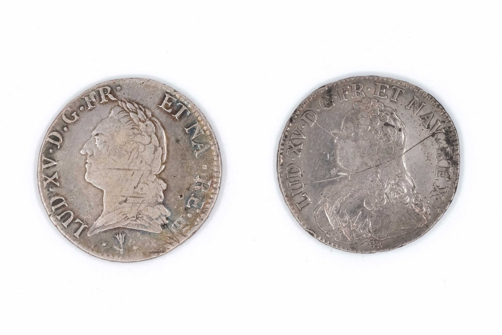 A lot of two French silver écus, dated 1726 and 1772: A lot of two French silver écus, dated 1726 and 1772. Comprising an issue of Louis XV with youthful bust and an issue of Louis XVI with draped bust, both with crowned oval shield bearing fleurs-de-li