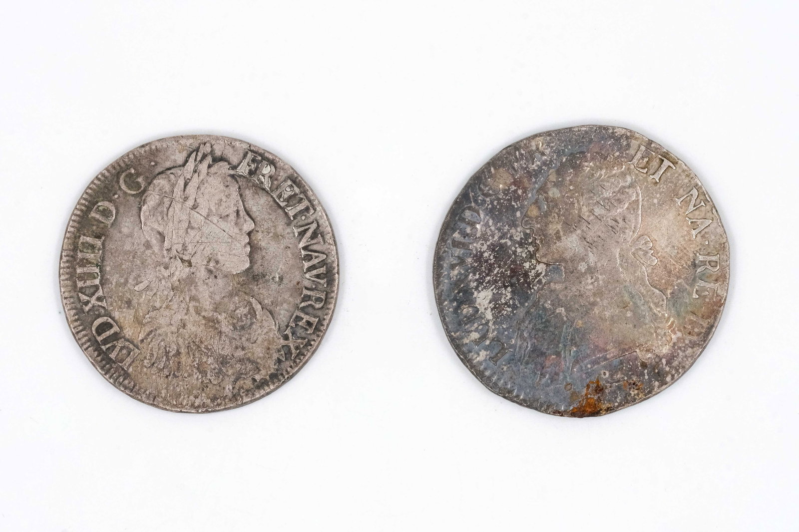 A lot of two French silver coins, dated 18th century: A lot of two French silver coins, dated 18th century. Comprising issues of French kings, including one of Louis XVI, both depicting draped busts, with crowned shield bearing fleurs-de-lis on the rever