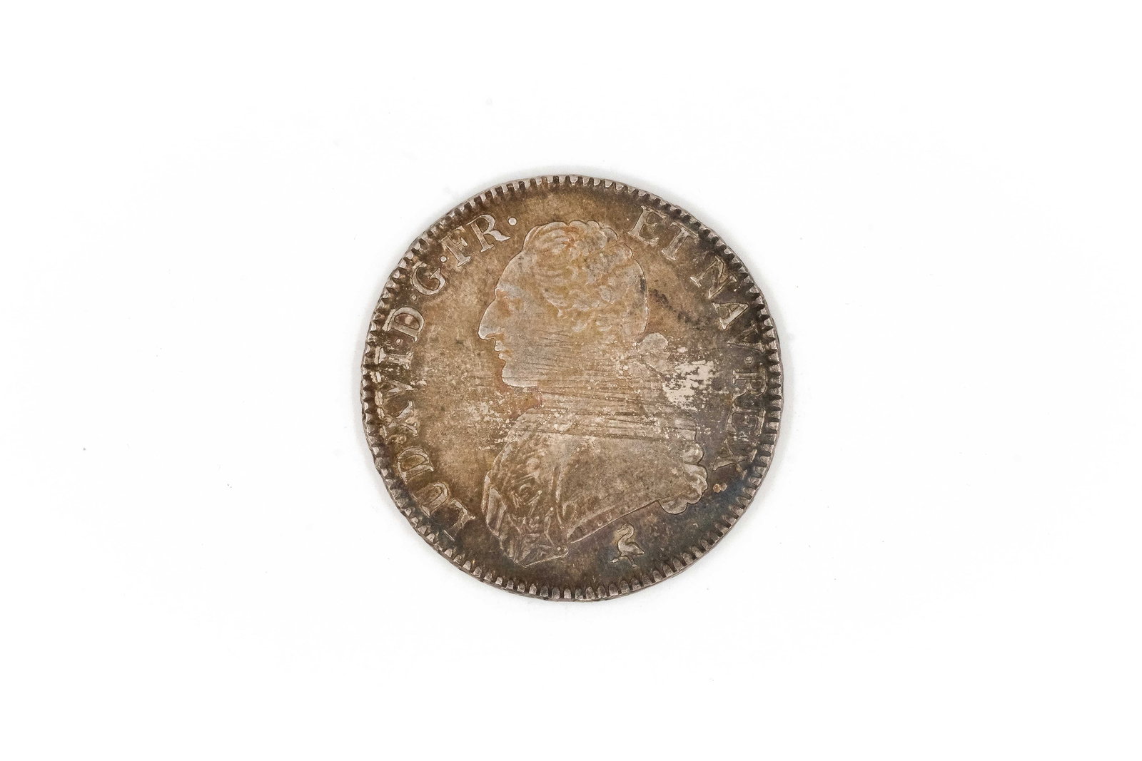 A French silver coin of Louis XVI, dated 1791: A French silver coin of Louis XVI, dated 1791. With draped bust of the king and crowned shield bearing fleurs-de-lis within wreath on the reverse. Weight: 29,5g