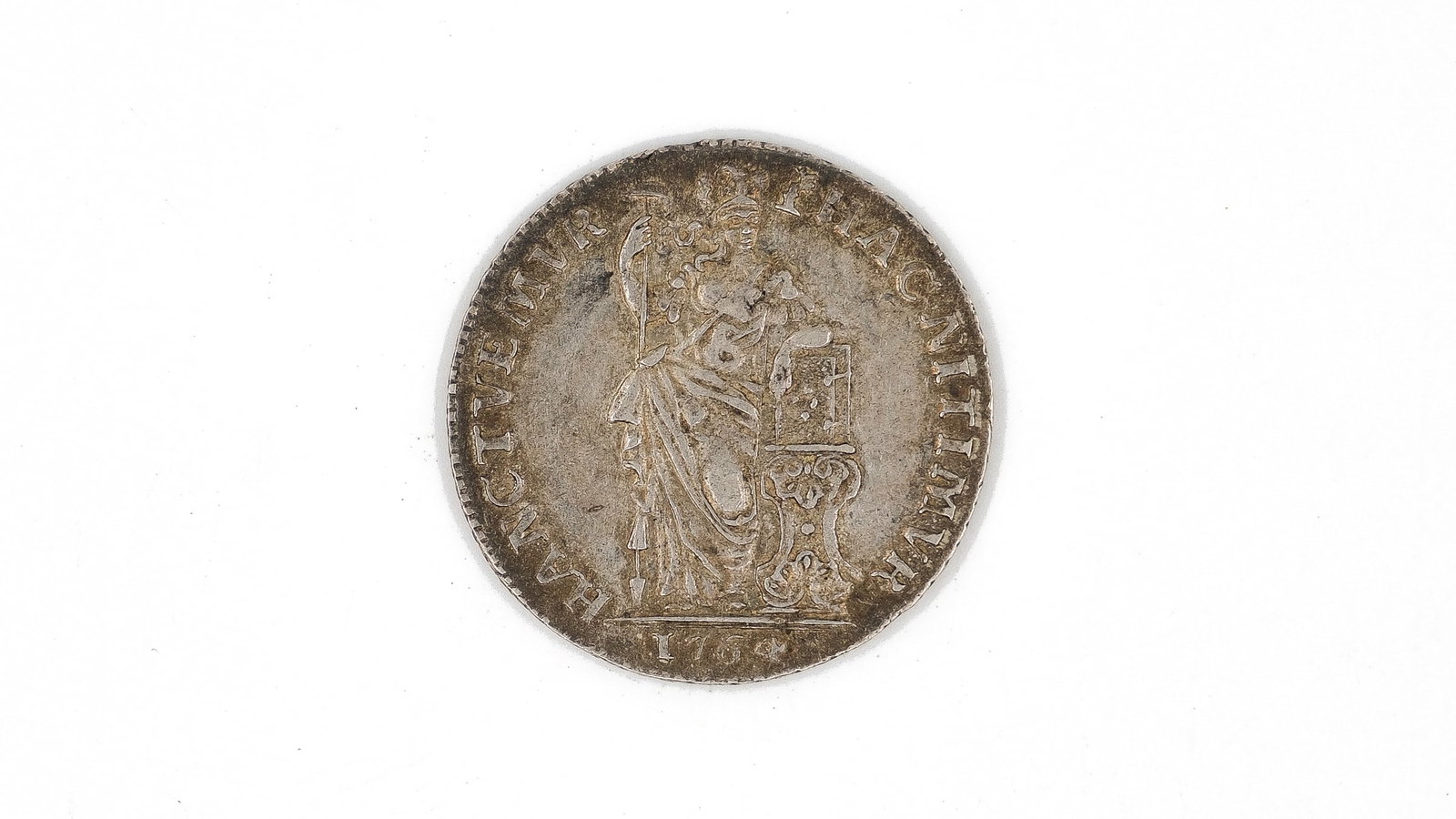A Dutch silver coin of the province of Utrecht, 1 gulden, dated 1764: A Dutch silver coin of the province of Utrecht, 1 gulden, dated 1764. With crowned shield flanked by value '1 GL' on the obverse and standing armoured figure on the reverse. Weight: 10,5g