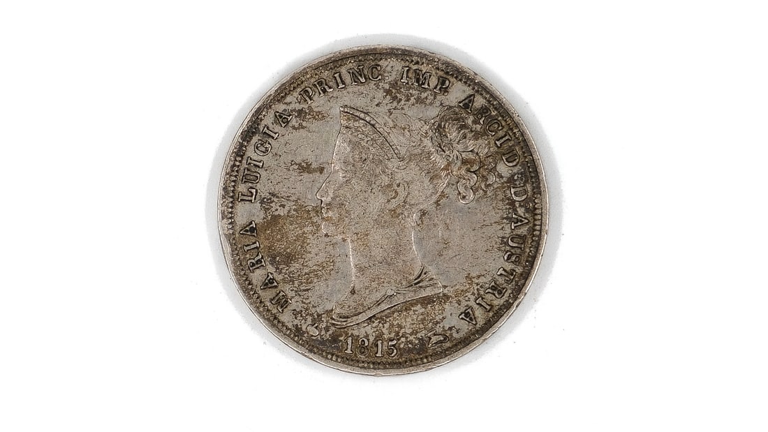 A silver 2 Lire coin of Maria Luigia, Duchess of Parma, dated 1815: A silver 2 Lire coin of Maria Luigia, Duchess of Parma, dated 1815. Obverse with left-facing bust of Maria Luigia. Reverse with crowned shield within mantle, denomination 2 Lire below. Weight: 10g