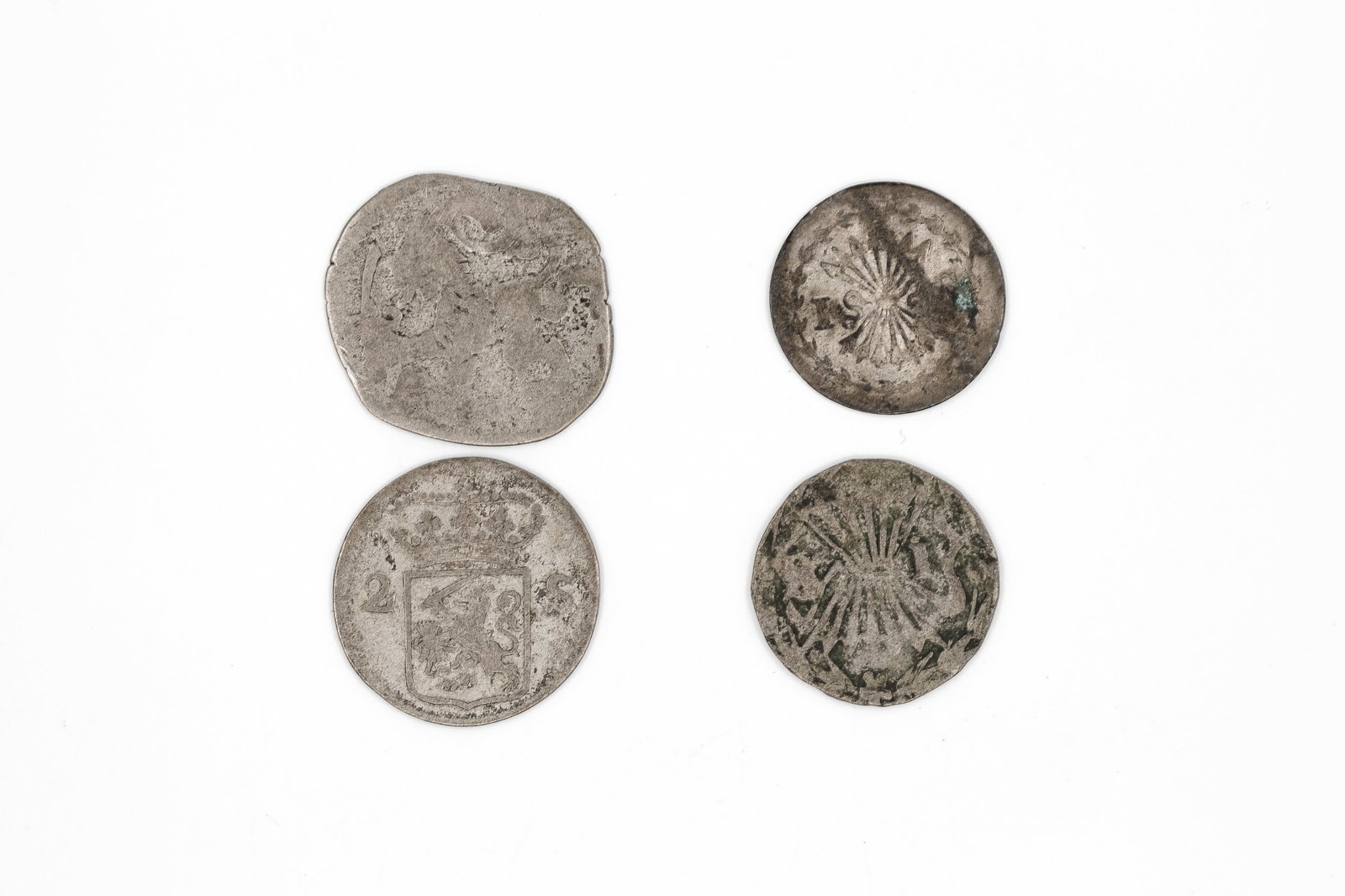 A lot of four European silver coins, dated 1628-1786: A lot of four European silver coins, dated 1628-1786. Comprising various issues from the Austrian Netherlands, the Dutch Republic and Transylvania, including a cob-type coin and smaller denomination p
