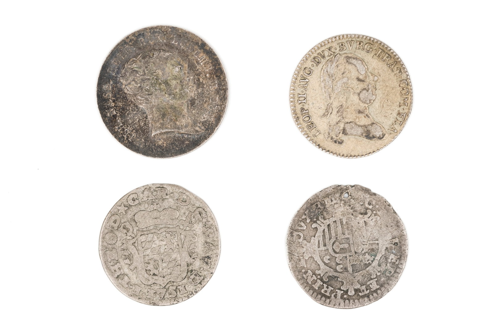 A lot of four European silver coins: A lot of four European silver coins. Comprising various portrait issues and earlier pieces, with crowned shield, wreath and armorial designs. Weight: 4,9 - 3,2 - 1,9 - 1,5g