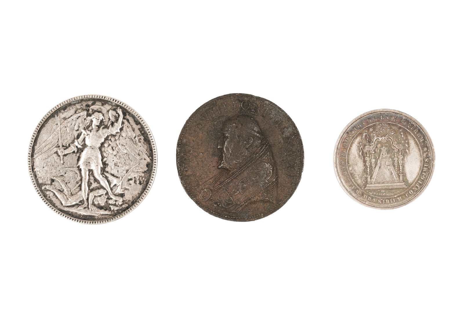 A lot of three European coins and medals: A lot of three European coins and medals. Comprising a French medal dated 1929 with inscription, a Vatican-related issue depicting a standing figure with legend, and a religious medal with architectur