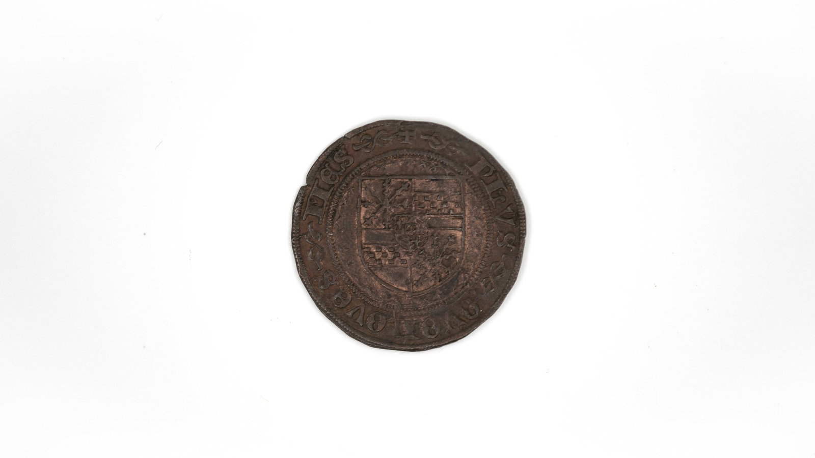 A European copper coin: A European copper coin. Featuring a crowned shield within legend on one side and a central monogram within ornamental design on the other. Weight: 4,5g