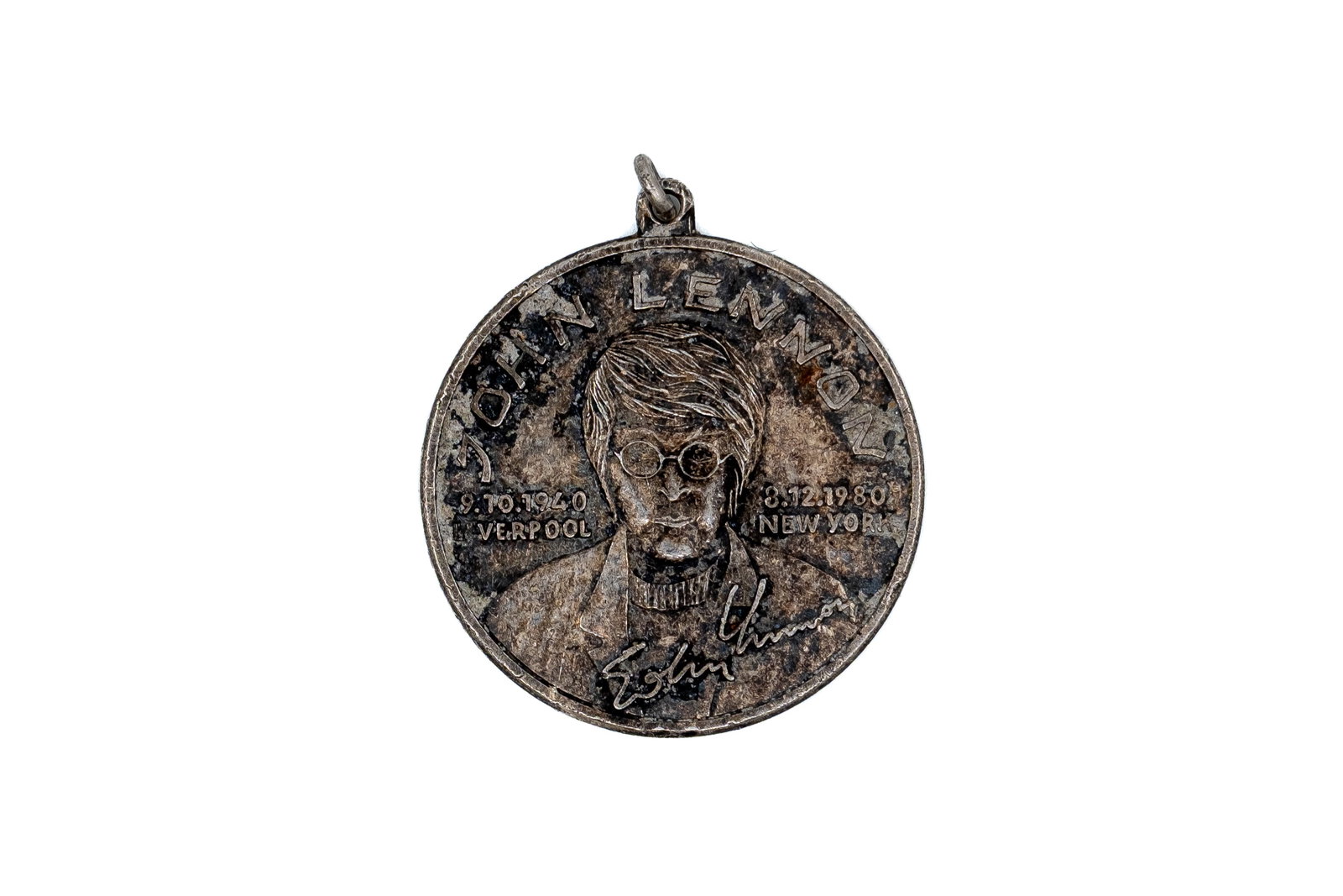 A silver commemorative medal featuring John Lennon, dated 1940-1980 (1 of 2)