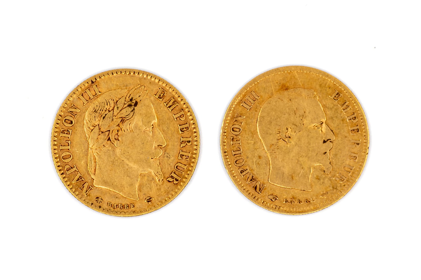 A lot of two French 10 francs gold coins dated 1855-1868: A lot of two French 10 francs gold coins dated 1855-1868. Featuring laureate and bare head of napoleon III on the obverse and denomination within wreath on the reverse. Total weight: 6,4 g