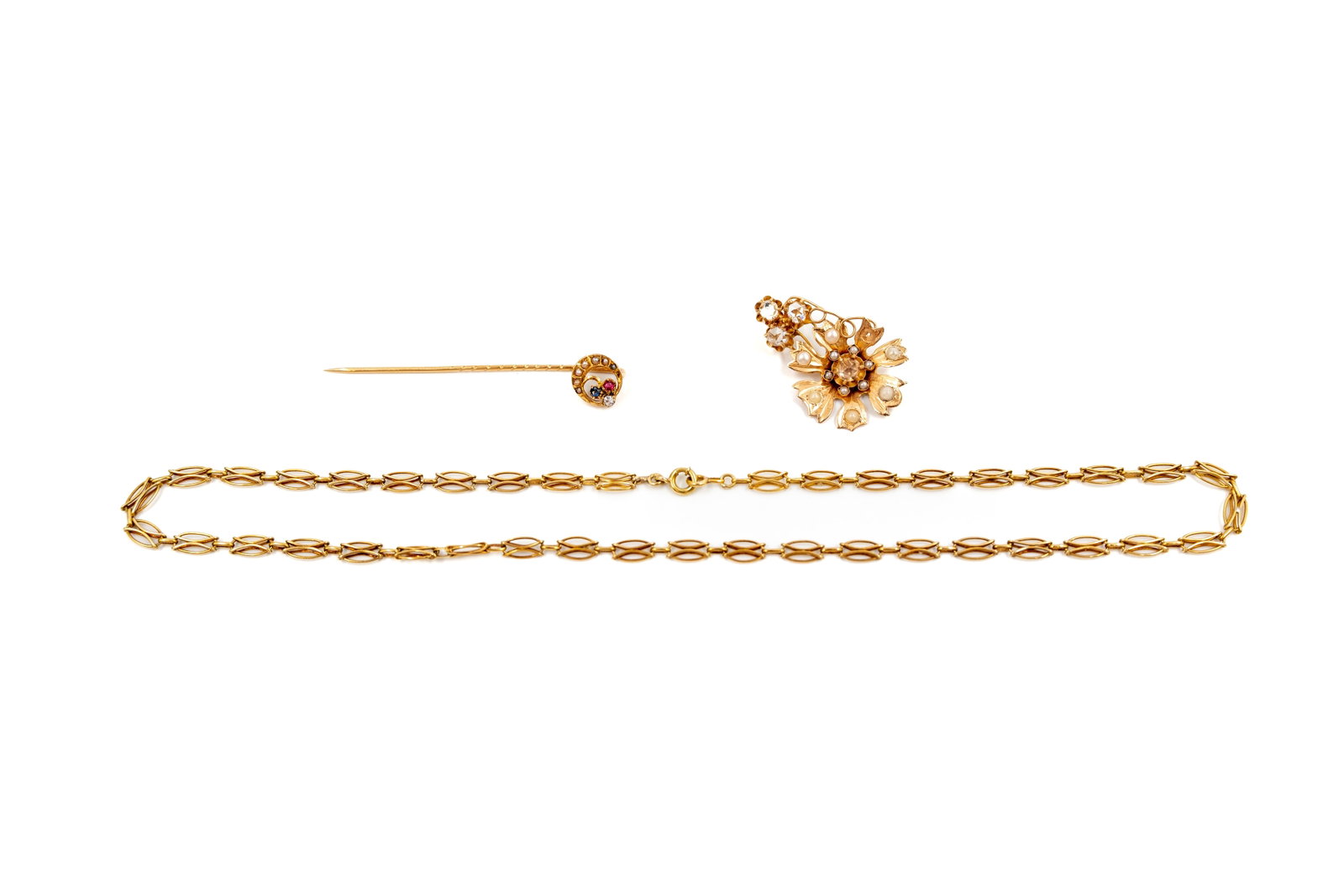 A composed lot of three 18k gold jewelry items (1 of 5)