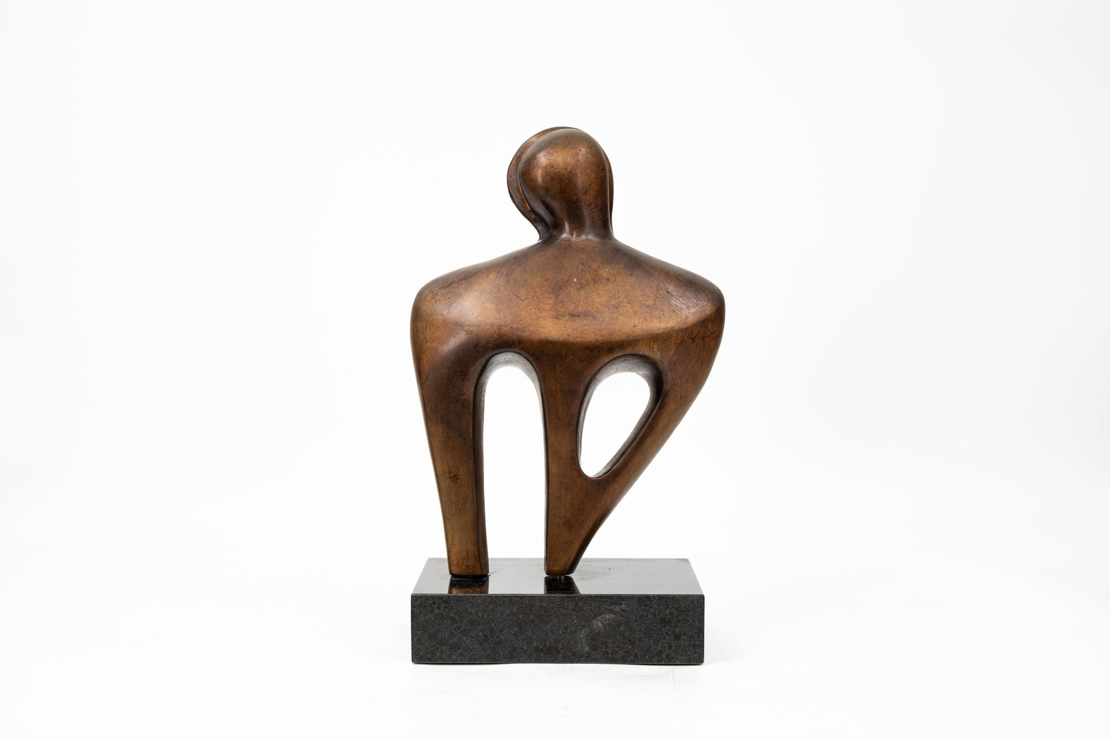 A modernistic patinated bronze art composition sculpture of a figure: A modernistic patinated bronze art composition sculpture of a figure. Footed on a marble base. Unsigned, circa 1970s. H: 37 cm