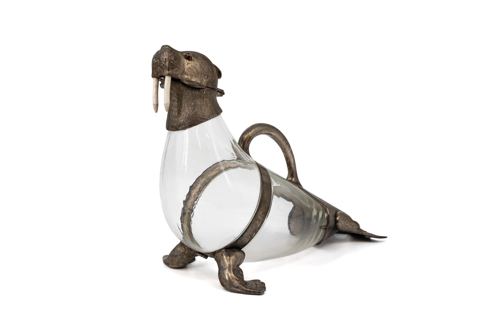 A large vintage chromed brass mounted walrus shaped decanter (1 of 11)