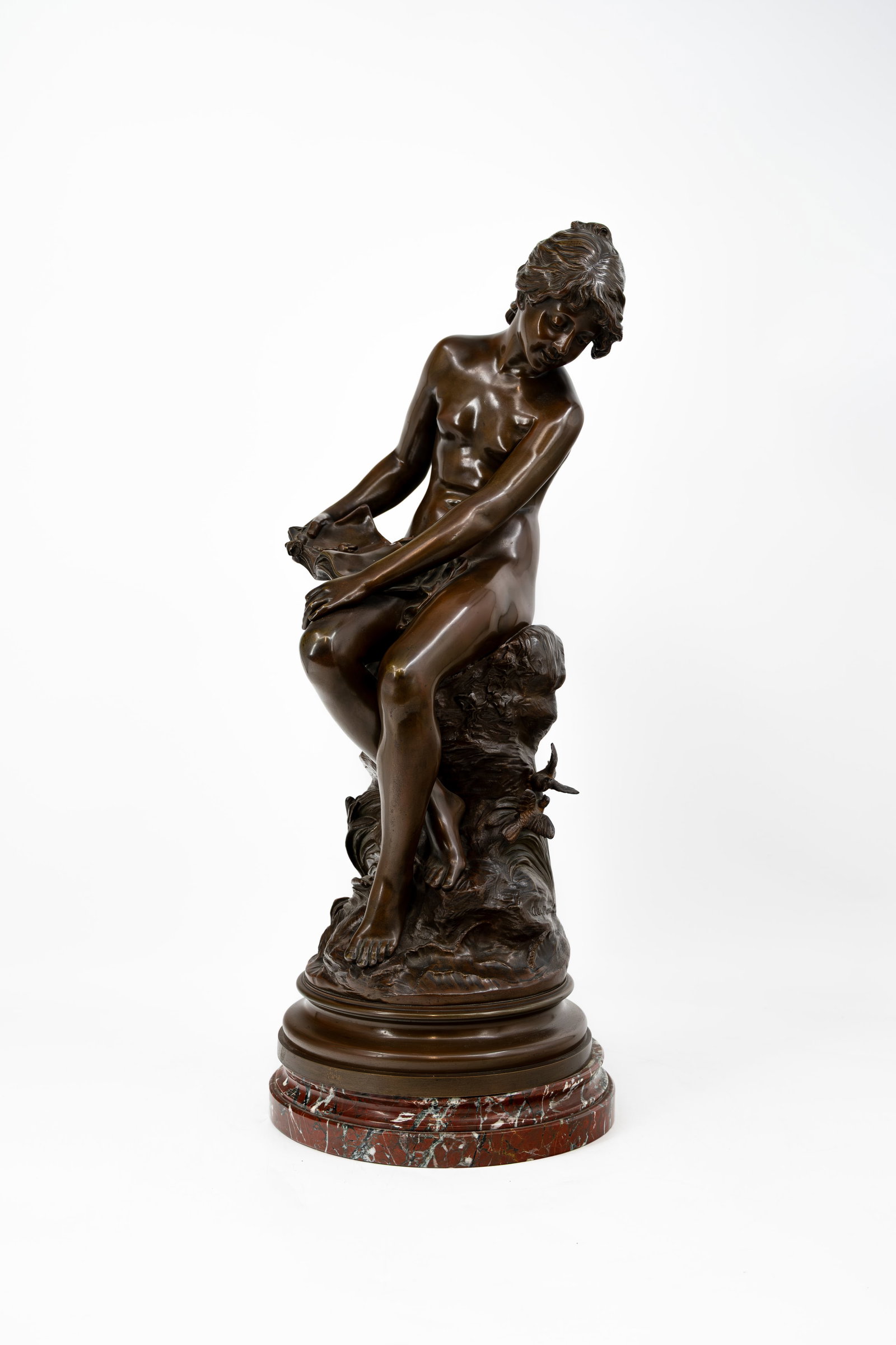 Auguste MOREAU (1834-1917) "Distraite". An antique French patinated bronze sculpture: Auguste MOREAU (1834-1917) "Distraite". An antique French patinated bronze sculpture of a girl distracted by birds. Mounted on a marble base. Signed, late 19th century. H: 65 cm