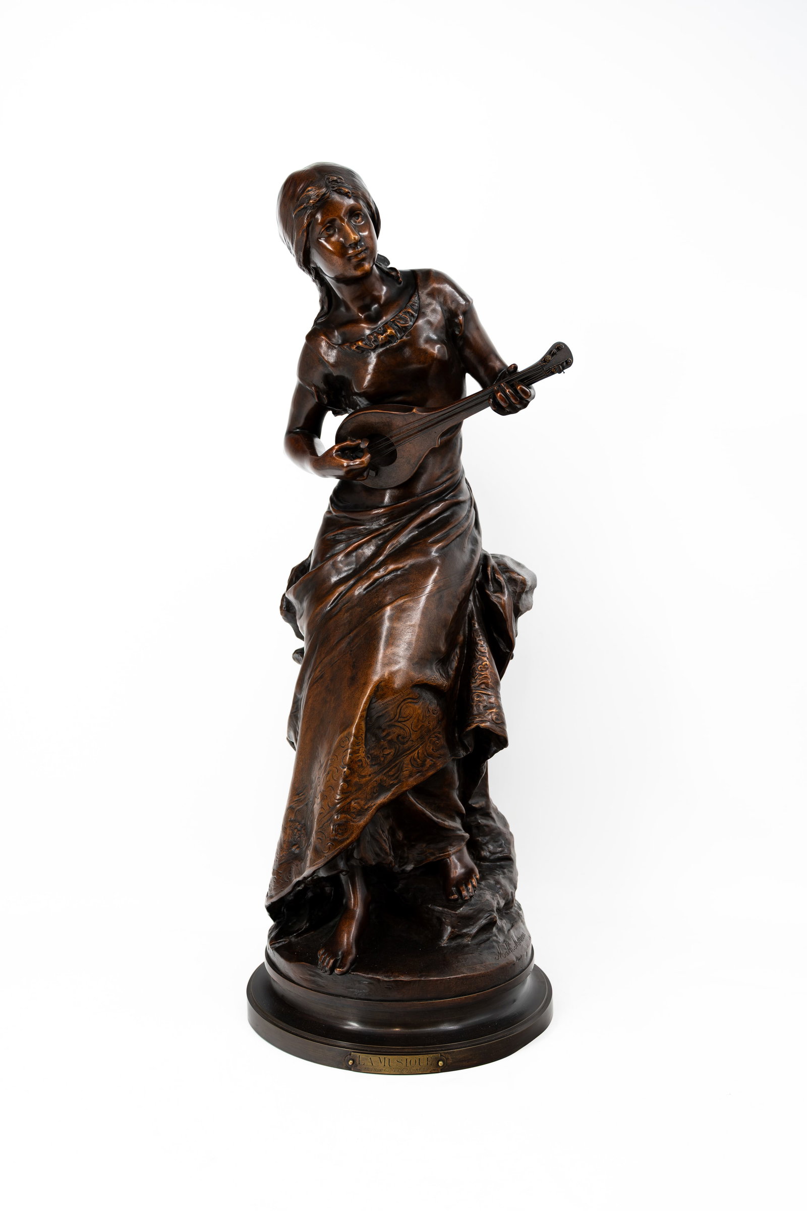 Mathurin MOREAU (1822-1912) "La Musique". An antique patinated bronze sculpture: Mathurin MOREAU (1822-1912) "La Musique". An antique patinated bronze sculpture of a girl playing the mandoline. Mounted on a rotating base. Signed and foundry stamp on the bronze, titled on the base.