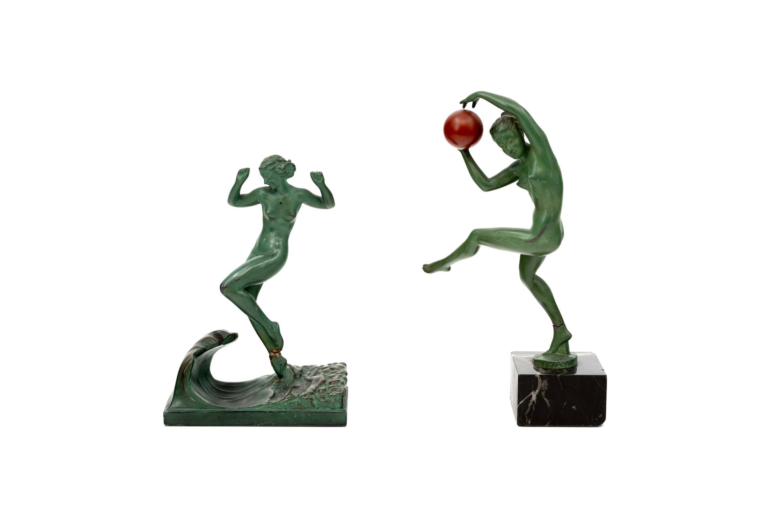 A lot of two art deco patinated spelter figures of dancing nude ladies: A lot of two art deco patinated spelter figures of dancing nude ladies. One footed on a marble base. Circa 1920s. Condition: both have been broken at the ankle, report available on request.