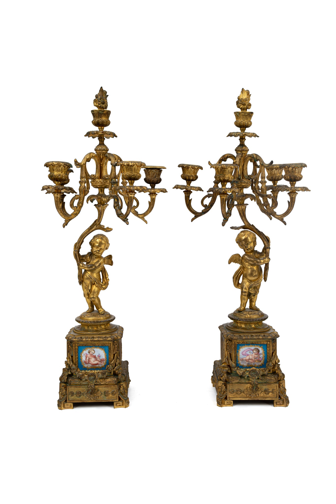 A pair of French Louis XV style gilt bronze and Sevres style porcelain mounted candelabras: A pair of French Louis XV style gilt bronze and Sevres style porcelain mounted candelabras with winged putti. Circa 1900. H: 54 cm