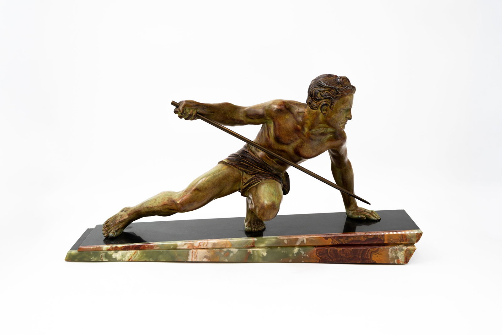 A large Art Deco multi-patinated spelter sculpture depicting an athletic man holding a spear (1 of 5)