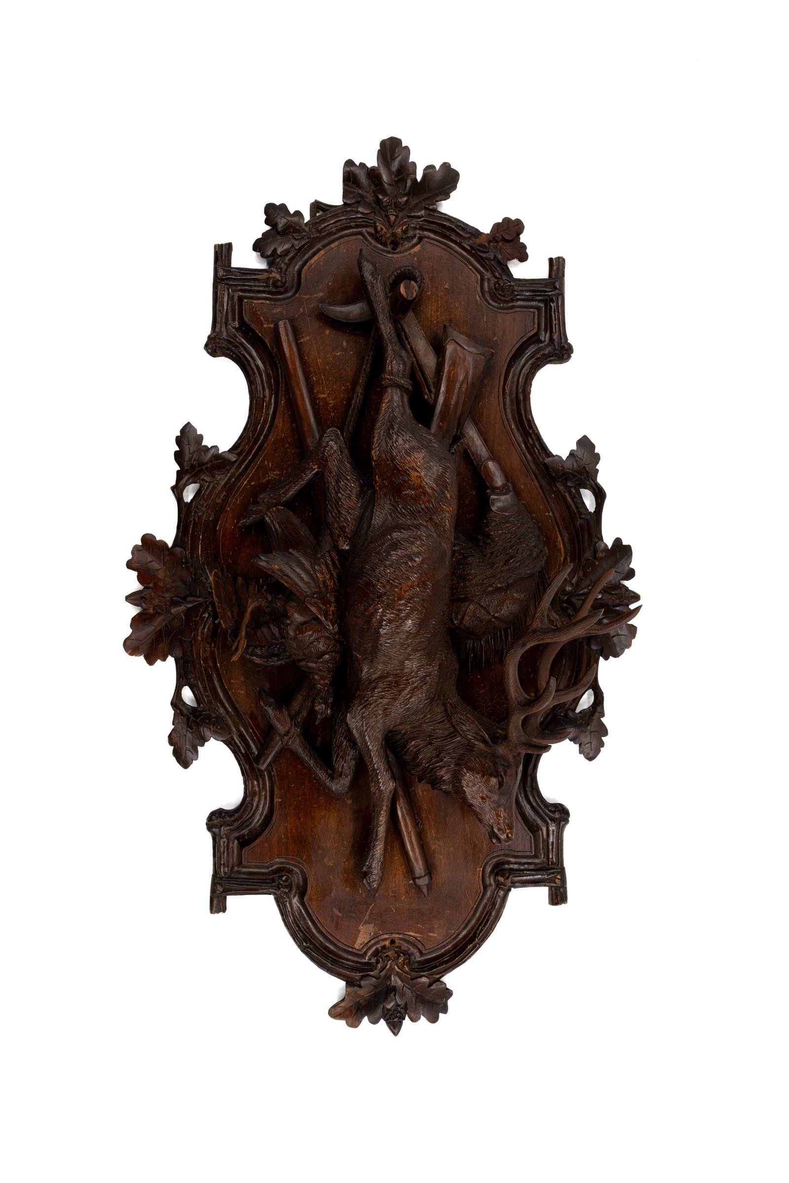 A large and antique German Black forest carved wooden wall plaque displaying hunting trophies (1 of 5)