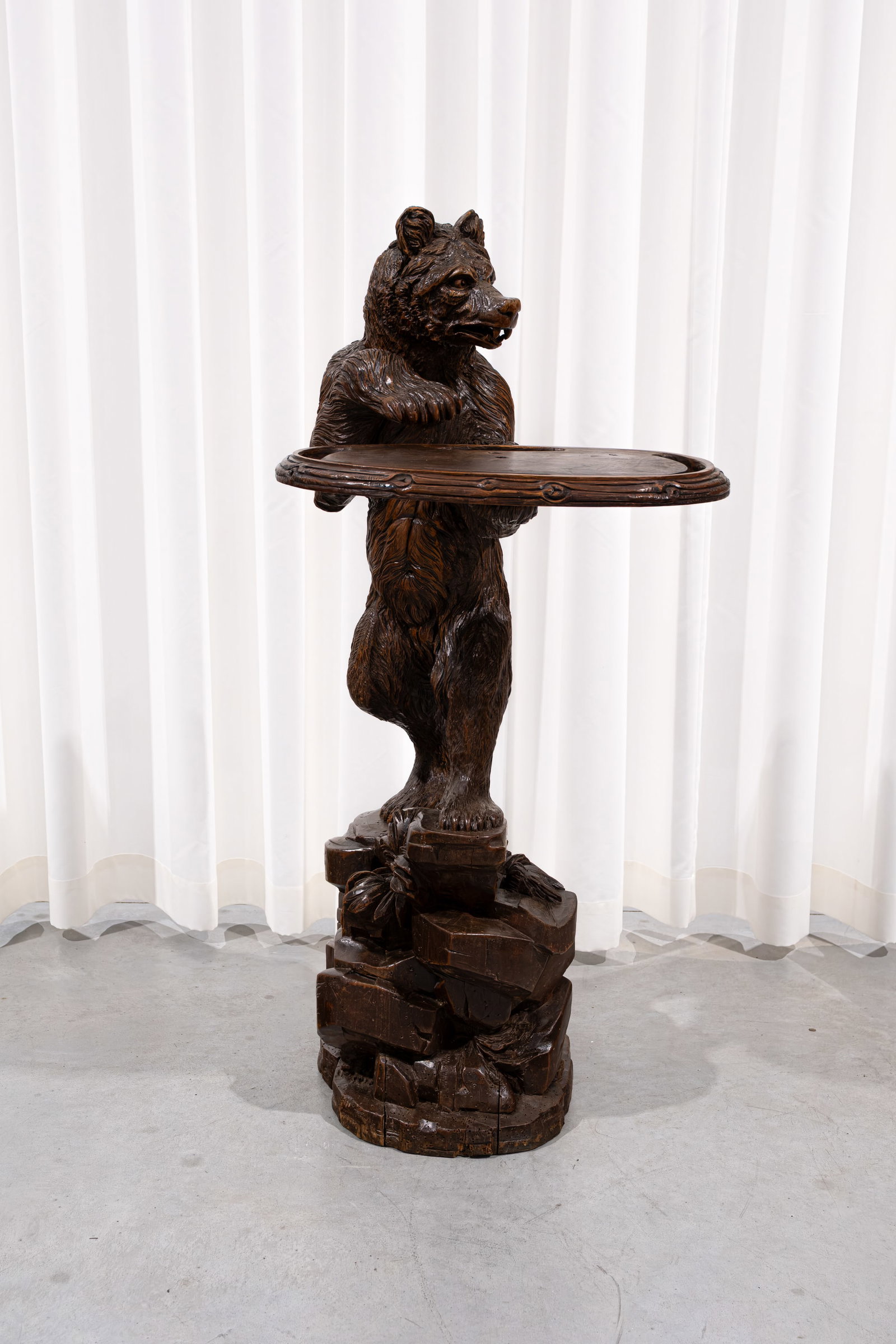 A large and antique German Black Forest carved wood sculpture of a standing bear holding a tray (1 of 8)