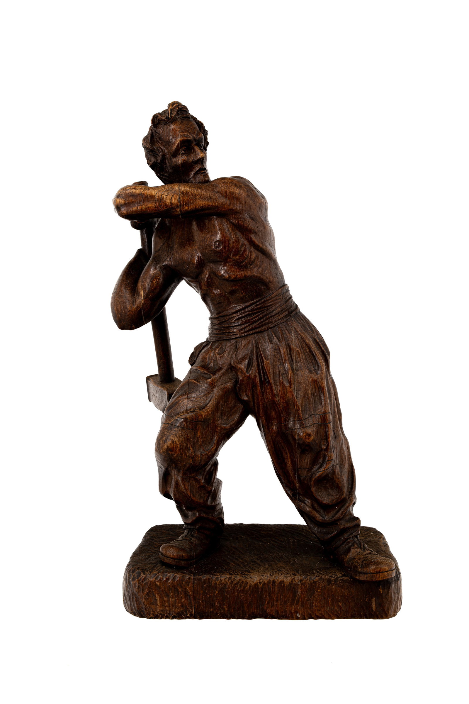 A large and antique German Black Forest carved wooden figure: A large and antique German Black Forest carved wooden figure depicting a standing labourer. Signed "Meelau" and dated 27-5-1943. H: 67 - W: 38 cm