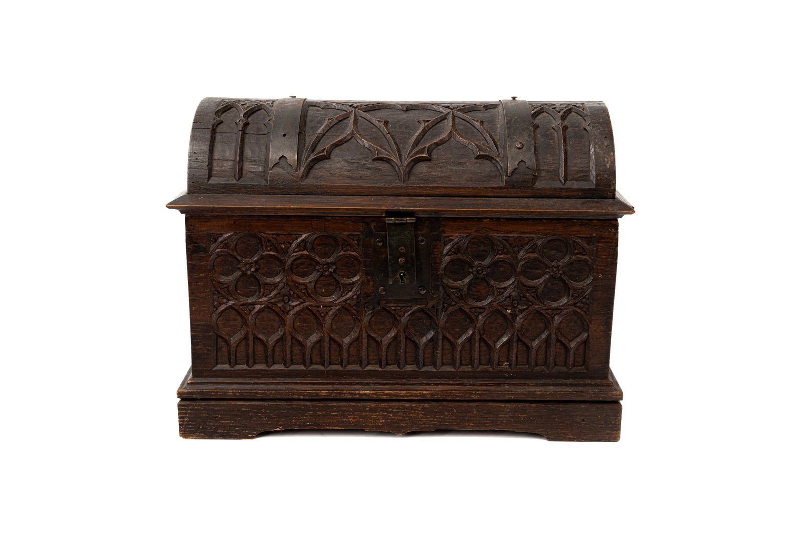 An antique German Black Forest carved wooden jewelry box: An antique German Black Forest carved wooden jewelry box in the shape of a chest decorated with gothic motives. 19th/20th century. H: 25 - W: 33,5 - D: 17 cm