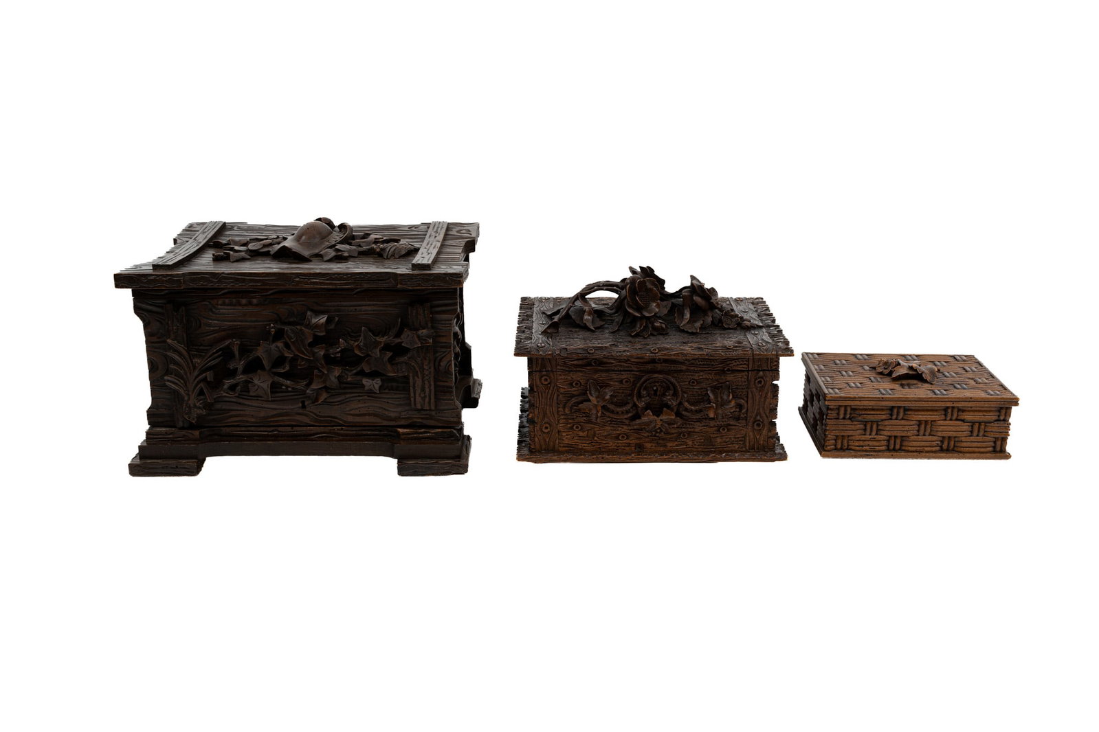 A composed lot of three antique German Black Forest variously decorated carved wooden boxes (1 of 10)
