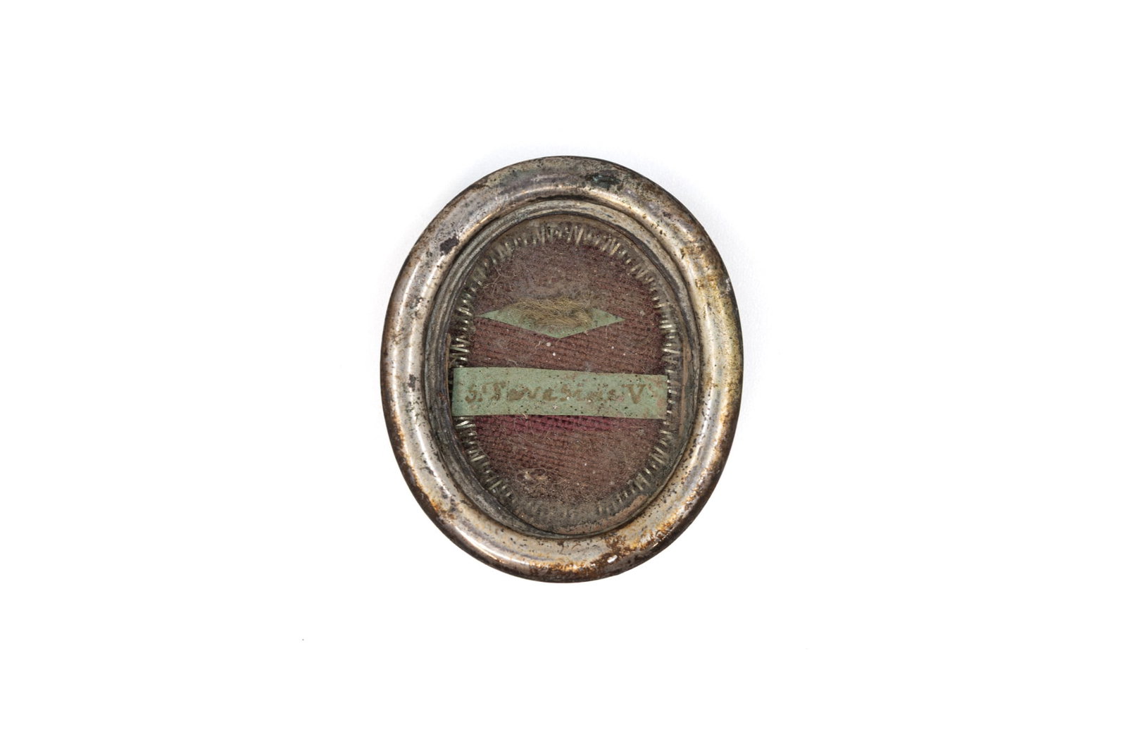 A sealed theca containing a relic from the garment of Saint Teresa (1 of 3)