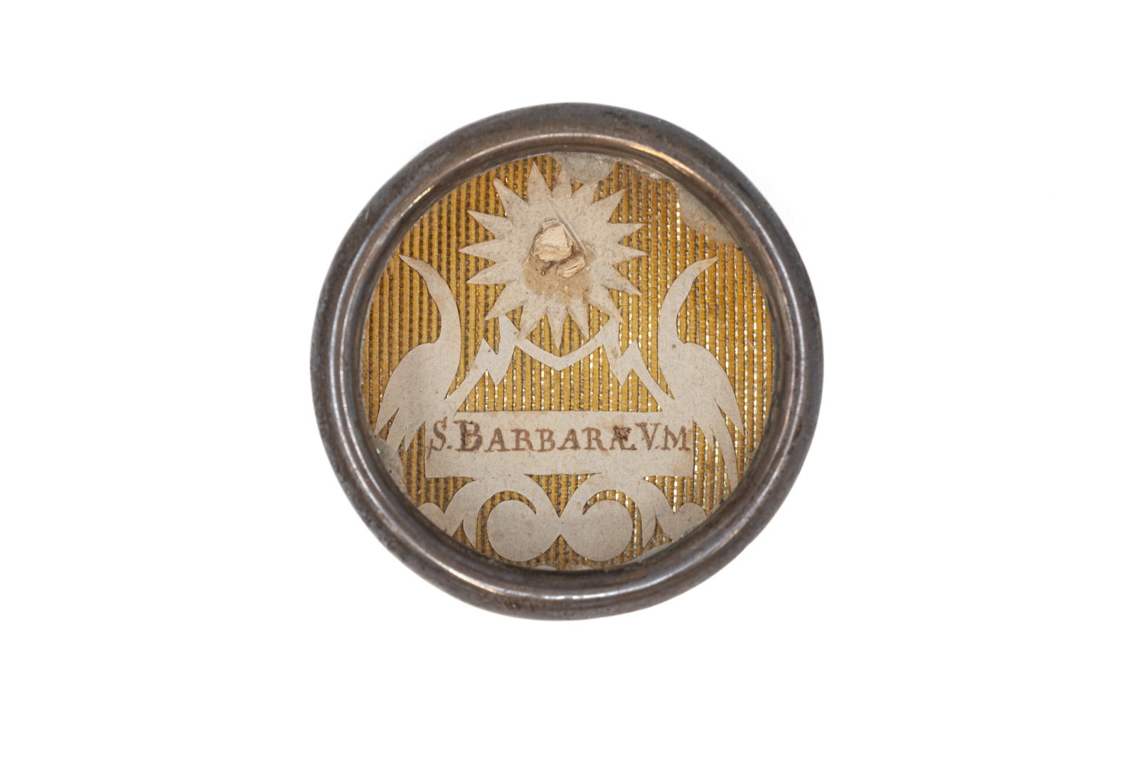 A sealed theca containing a relic of Saint Barbara, with a Certificate of Authenticity: A sealed theca containing a relic of Saint Barbara, Virgin and Martyr, with an Engelbertus Certificate of Authenticity. "S. Barbarae. V. M." 1839 W: 3,5 cm The theca and any accompanying documentation