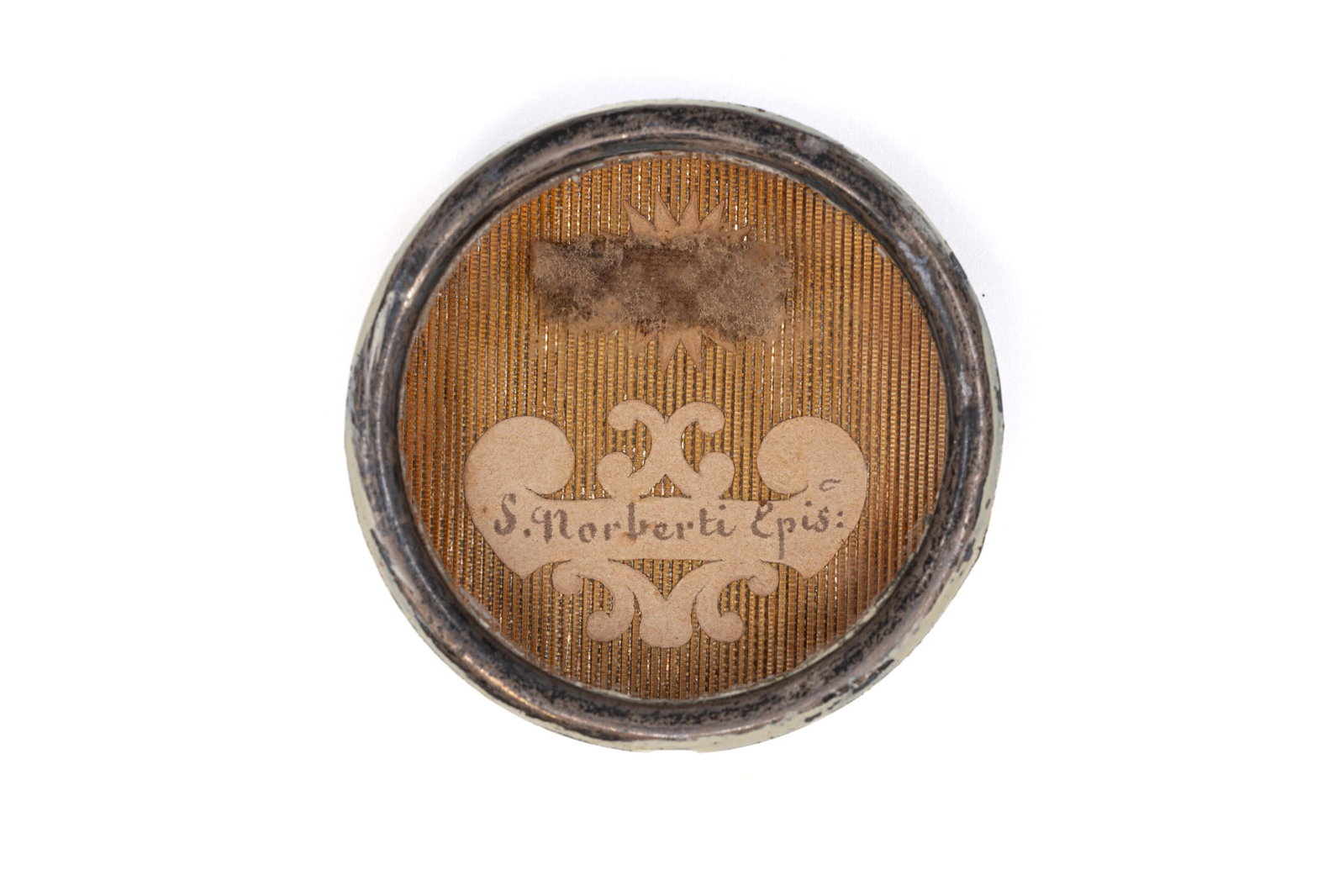 A sealed theca containing a relic of Saint Norbert, with a Certificate of Authenticity (1 of 3)