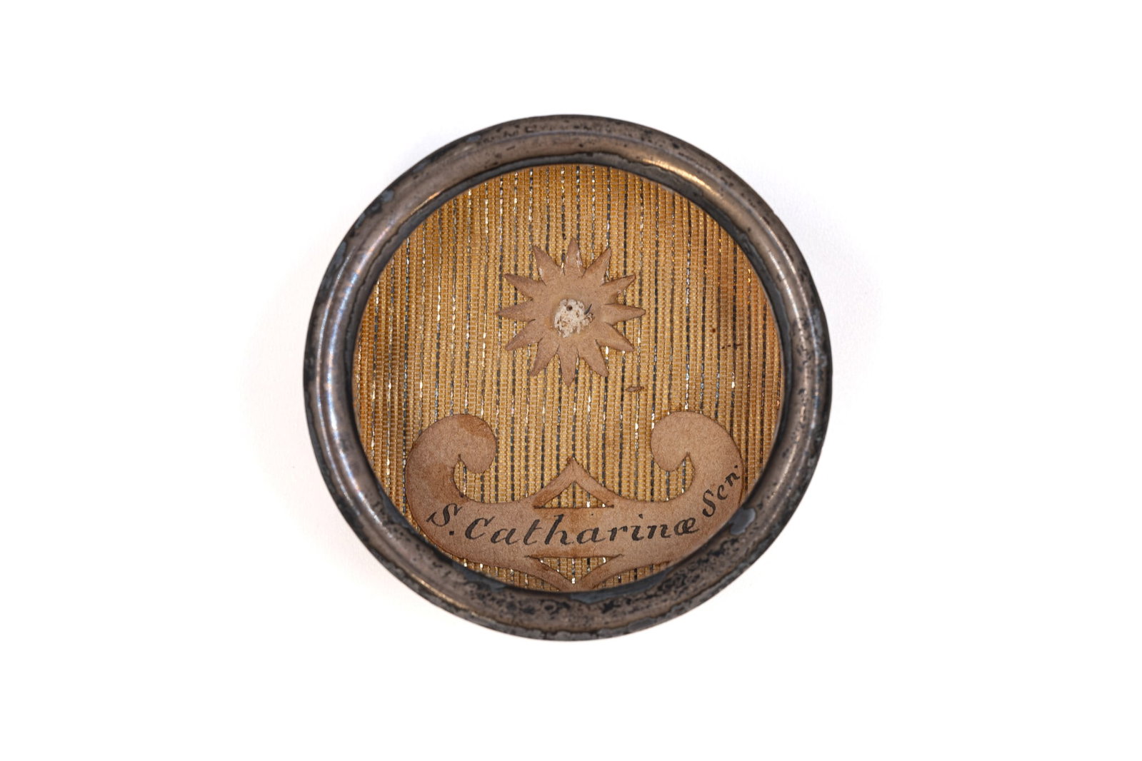 A sealed theca containing a relic of Saint Catherine of Siena, with a Certificate of Authenticity (1 of 3)