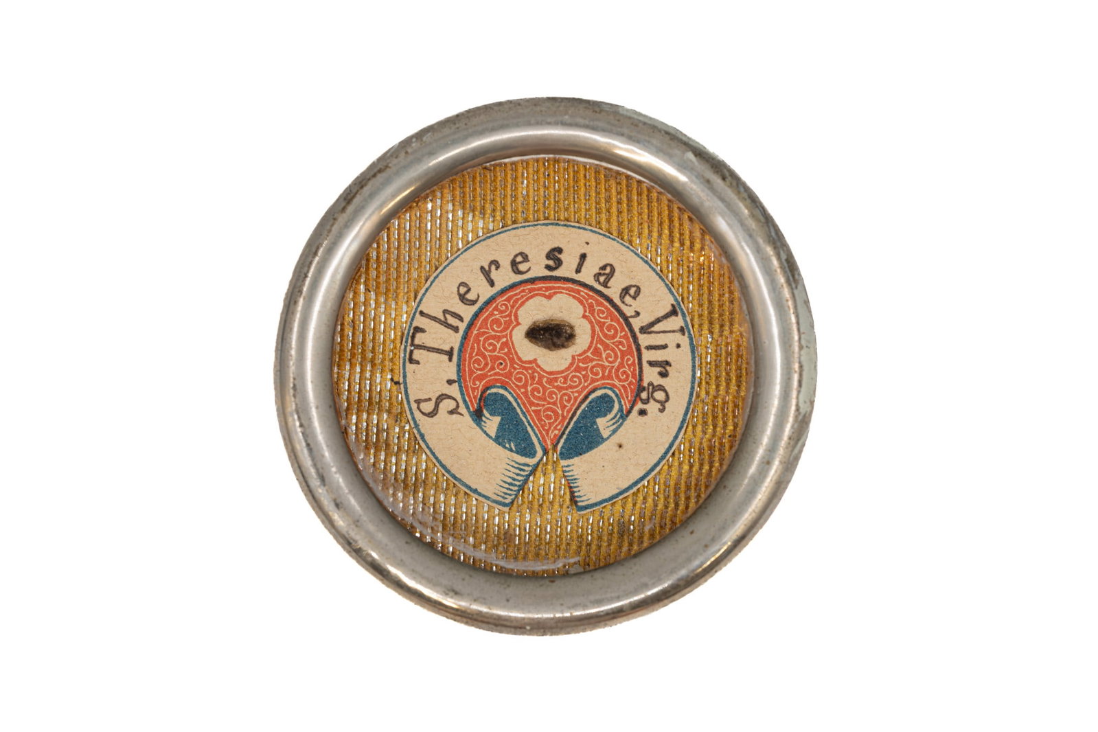 A sealed theca containing a relic of Saint Teresa of ?vila, with a Certificate of Authenticity (1 of 3)