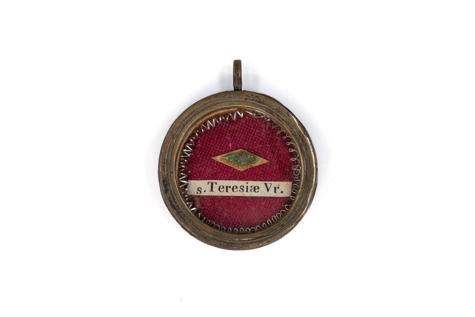 A pendant reliquary containing a relic of Saint Teresa of ?vila, with a Certificate of Authenticity (1 of 4)