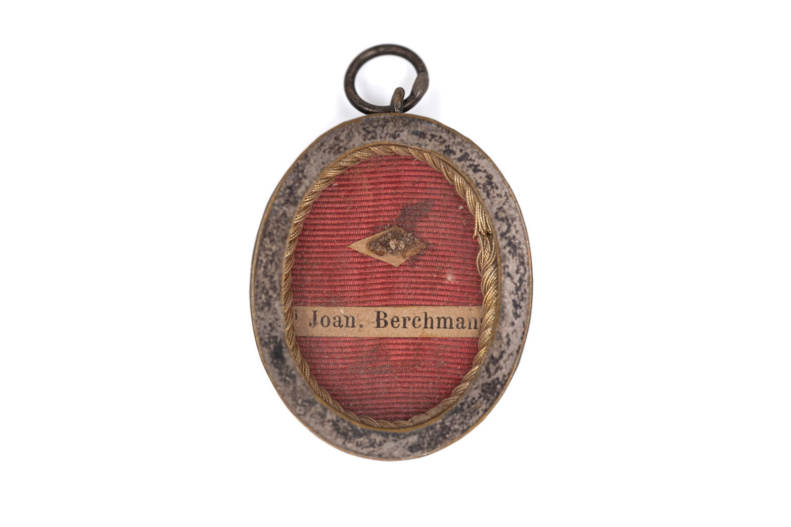A pendant reliquary containing a relic of Saint John Berchmans, with a Certificate of Authenticity (1 of 4)