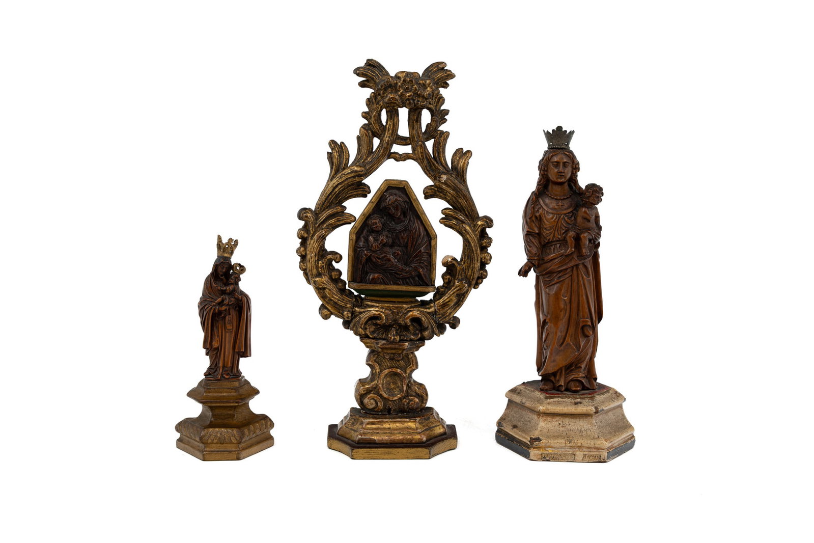 A composed lot of three antique polychrome patinated carved wood religious sculptures: A composed lot of three antique polychrome patinated carved wood religious sculptures. Consisting of: one giltwood reliquary with Madonna and Child, two finely carved fruitwood figures with Mother and