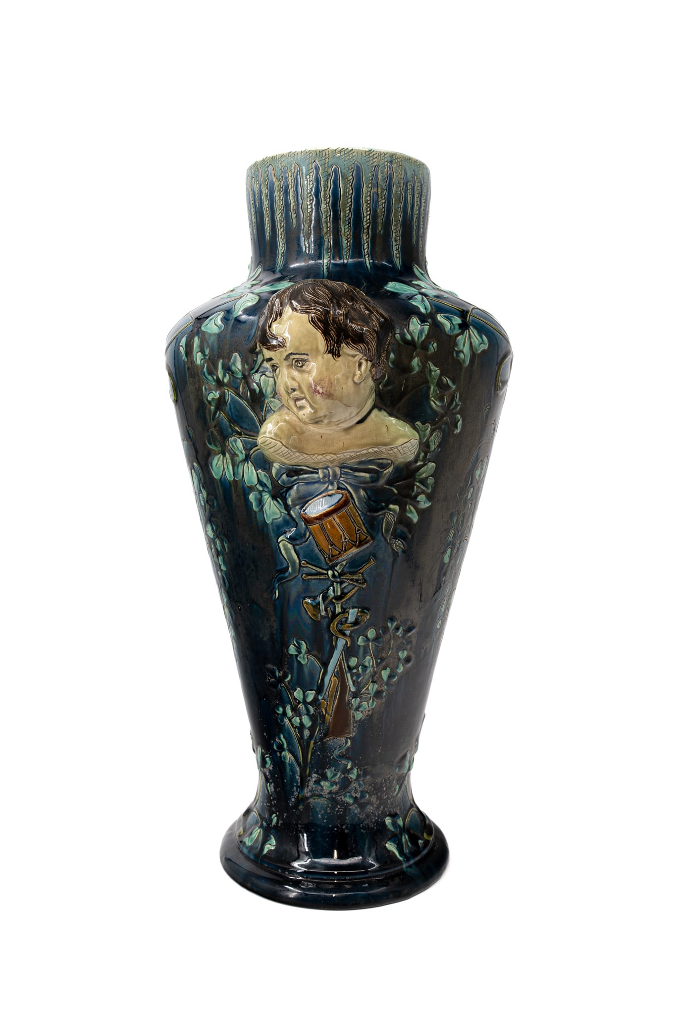 A large barbotine majolic art nouveau decorated ceramic vase: A large barbotine majolic art nouveau decorated ceramic vase with a relief figure of a child. Circa 1900. H: 85 cm