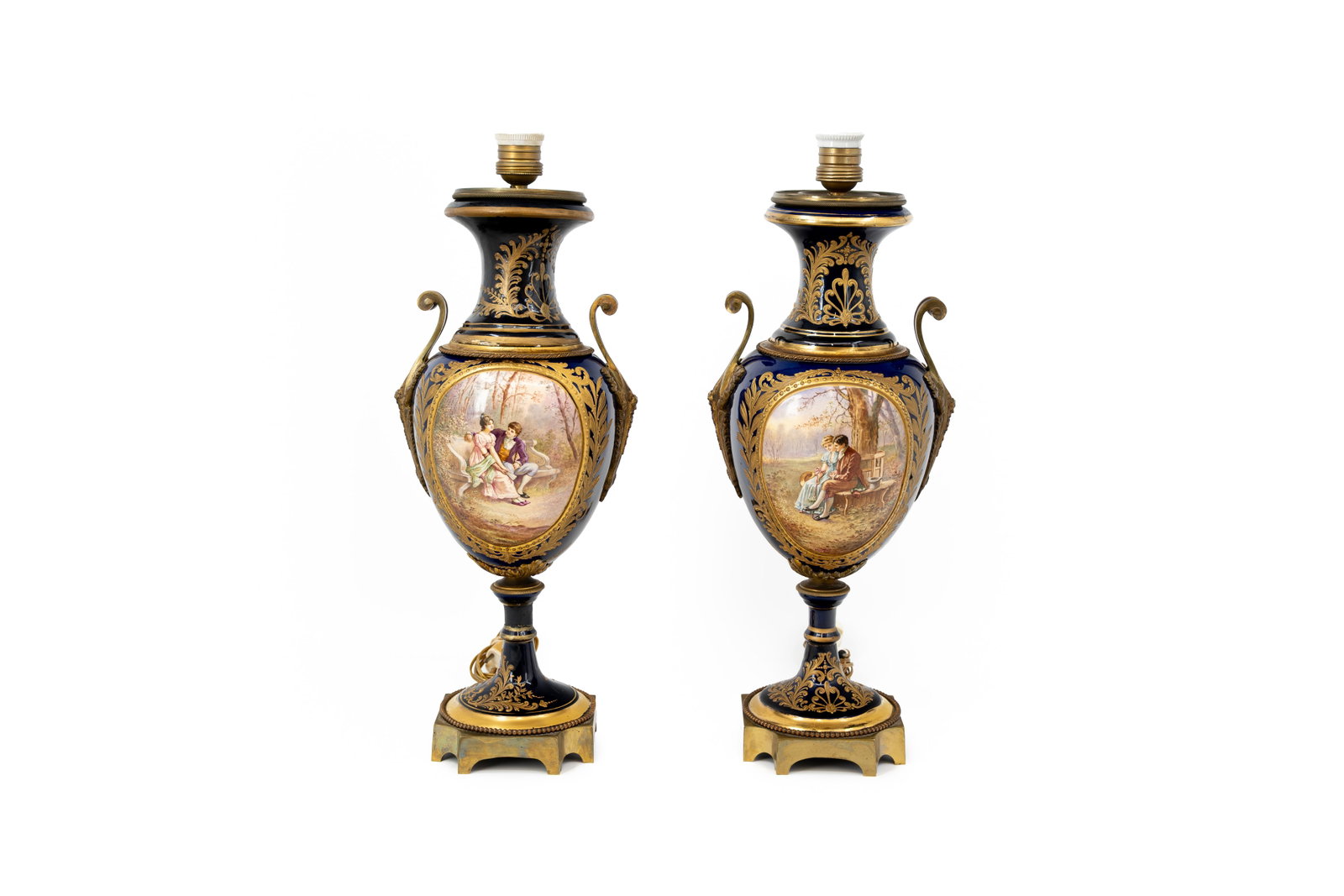 A pair of antique French Sevres style gilt cobalt and decorated porcelain lamp vases with bronze: A pair of antique French Sevres style gilt cobalt and decorated porcelain lamp vases with bronze mountings and figural hand-painted scenes. Late 19th century. Condition: both bases have old restoratio
