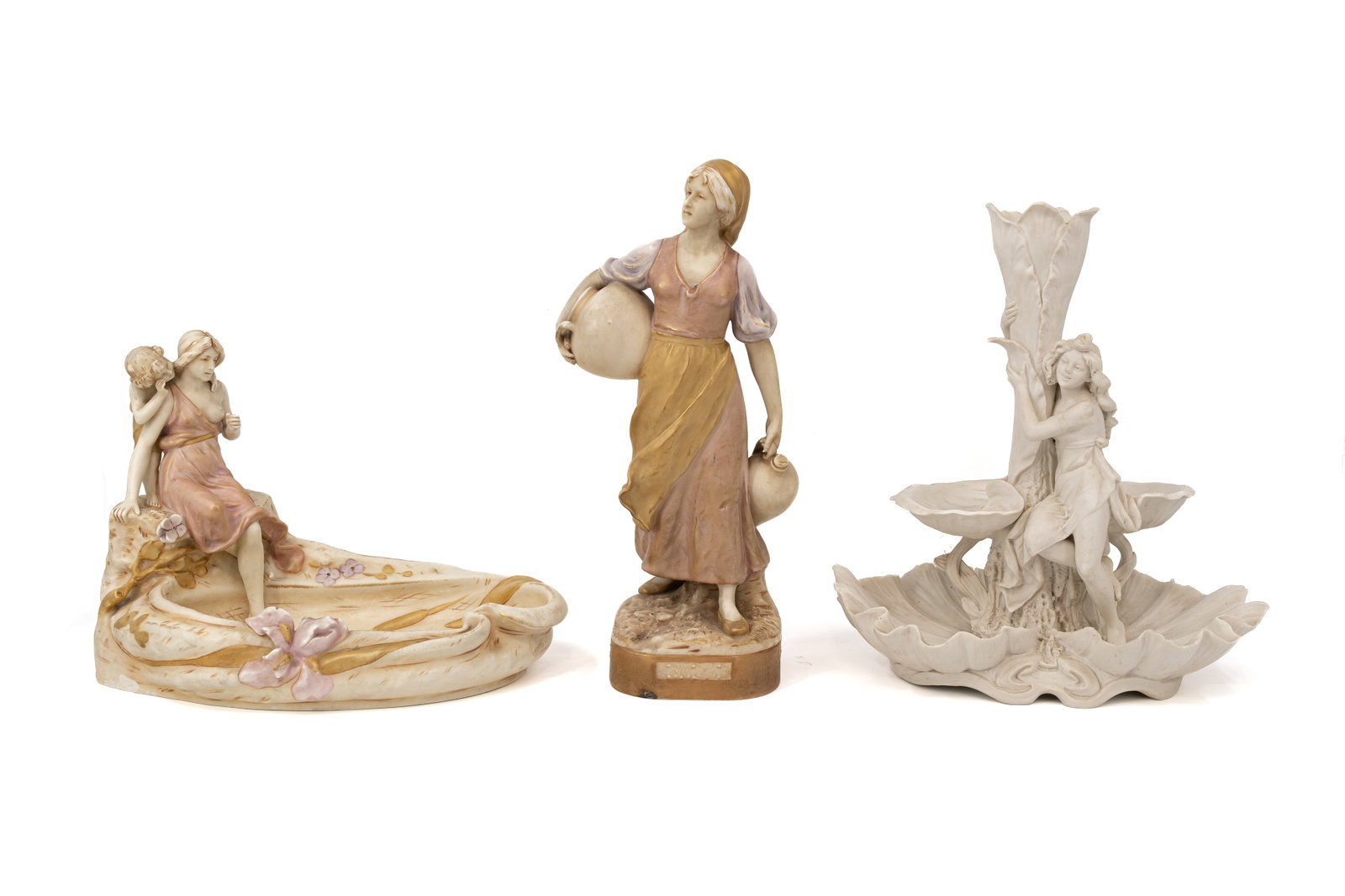 A composed lot of three Art Nouveau Bohemian Royal Dux porcelain items: A composed lot of three Art Nouveau Bohemian Royal Dux porcelain items. Marked and first half of the 20th Century. H: 25 - 38 - 35 cm.