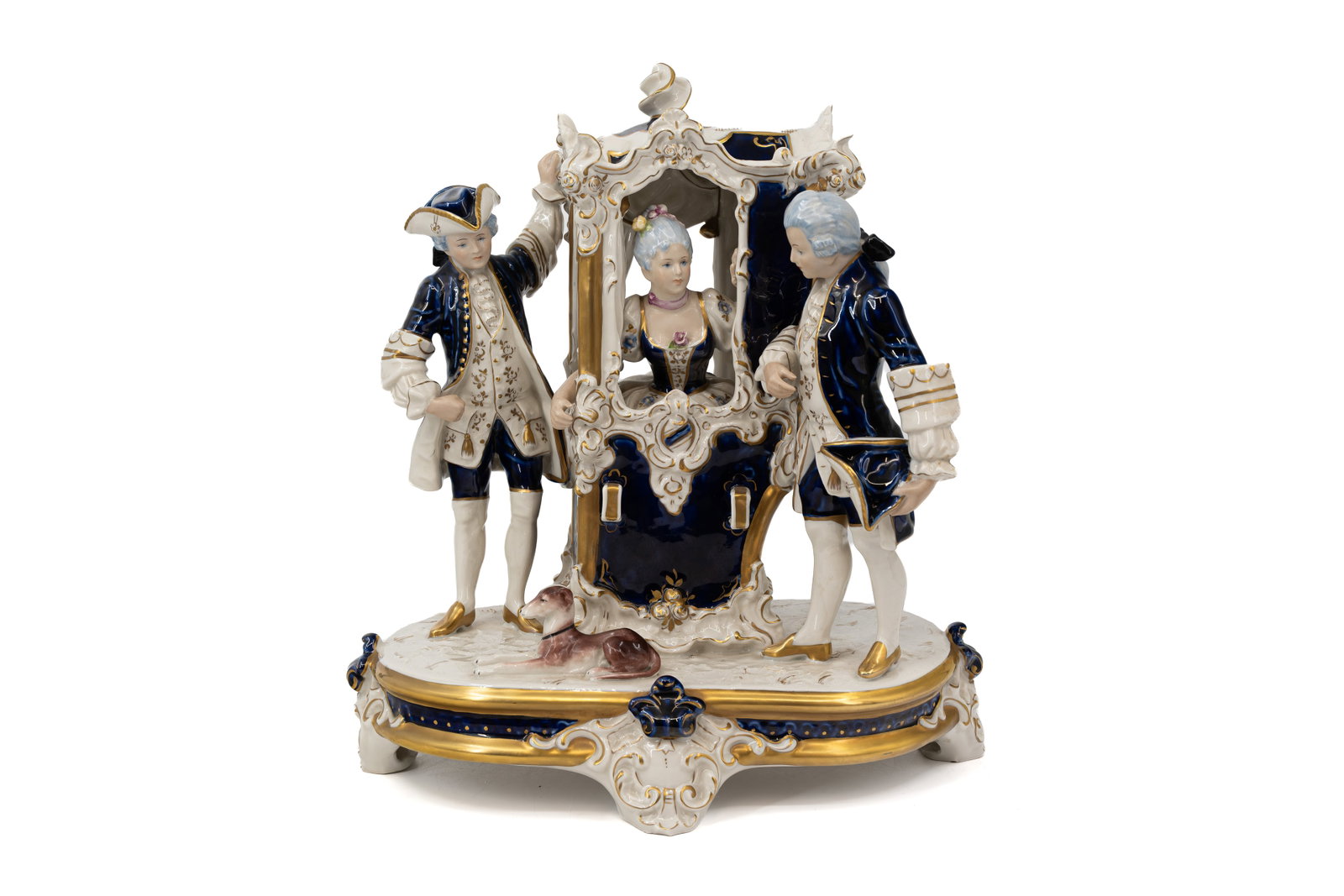 A Bohemian Royal Dux cobalt blue decorated figural porcelain carriage group: A Bohemian Royal Dux cobalt blue decorated figural porcelain carriage group. Marked and 20th Century. H: 40 - W: 35 cm