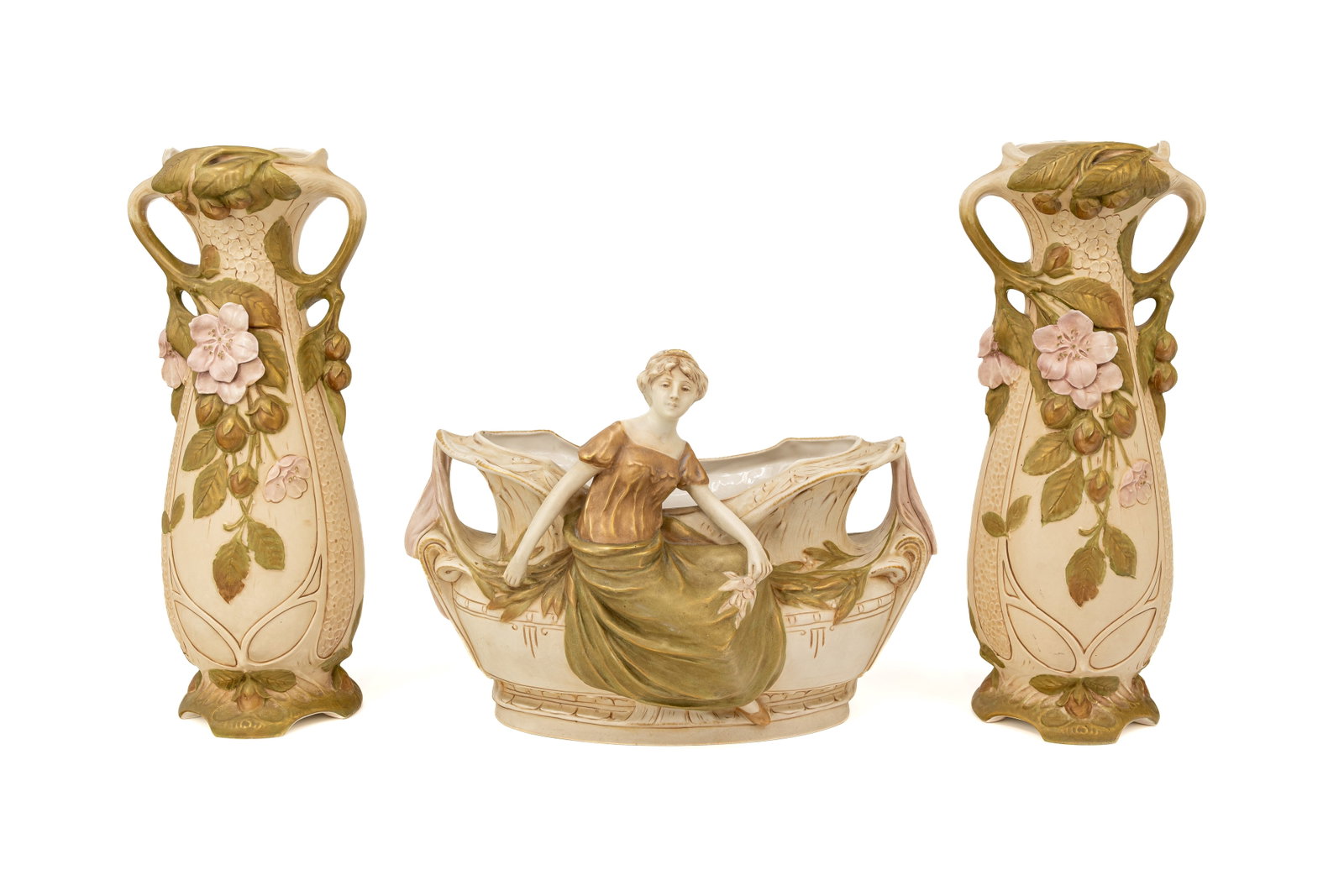 An Art Nouveau Bohemian Royal Dux figural porcelain jardiniere assembled with two matching vases: An Art Nouveau Bohemian Royal Dux figural porcelain jardiniere assembled with two matching vases. Marked and first half of the 20th Century. H: 41 - 27 - 41,5 cm.